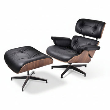 Black leather Eames-inspired lounge chair and ottoman arranged as living room seating