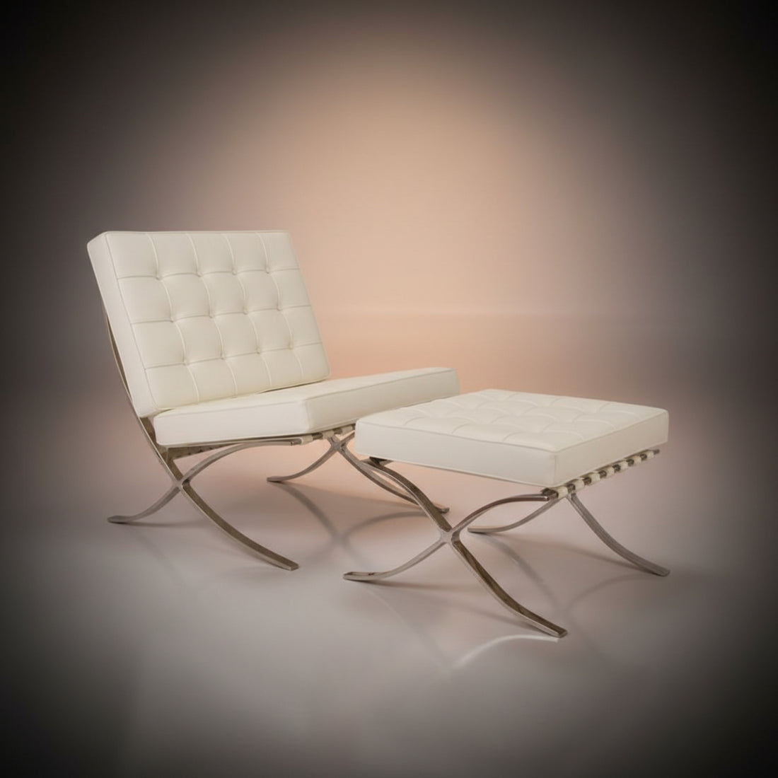 A modern tufted lounge chair with a matching ottoman, upholstered in off-white leather with polished chrome S-shaped legs