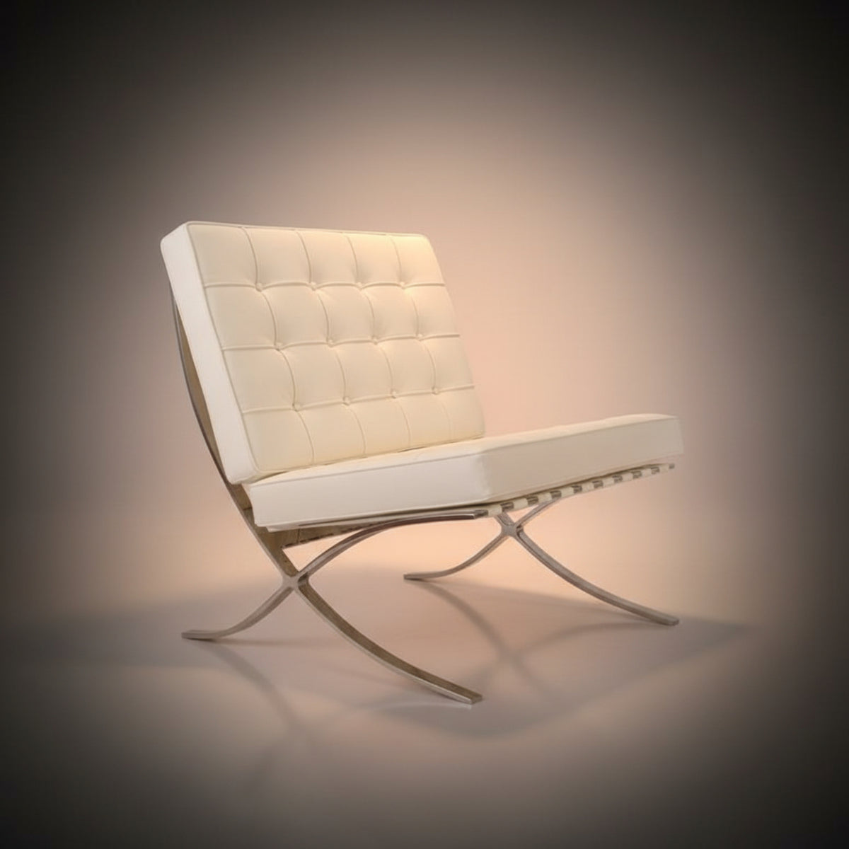 A modern Barcelona-style accent chair with cream tufted leather upholstery and a curved chrome metal base