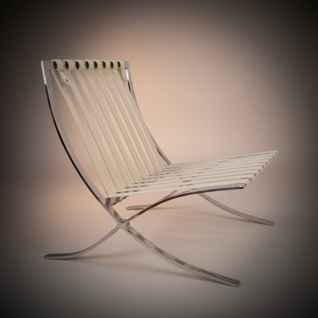 A modern curved lounge chair with a white slatted seat and backrest supported by a chrome metal frame