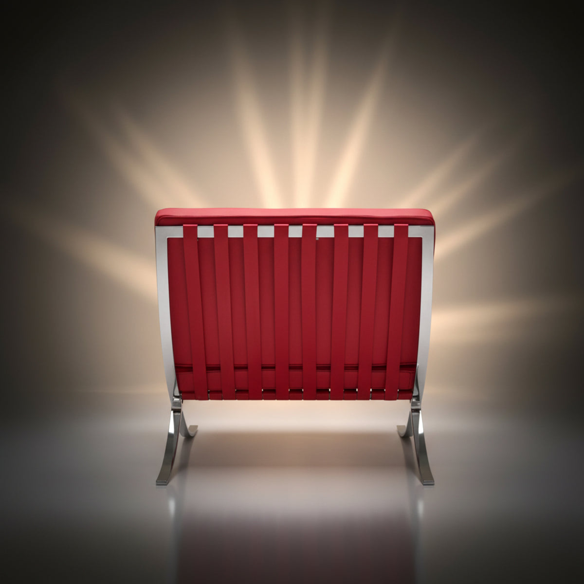 A modern red slatted bench with a silver metal frame and legs, centered against a dark studio background