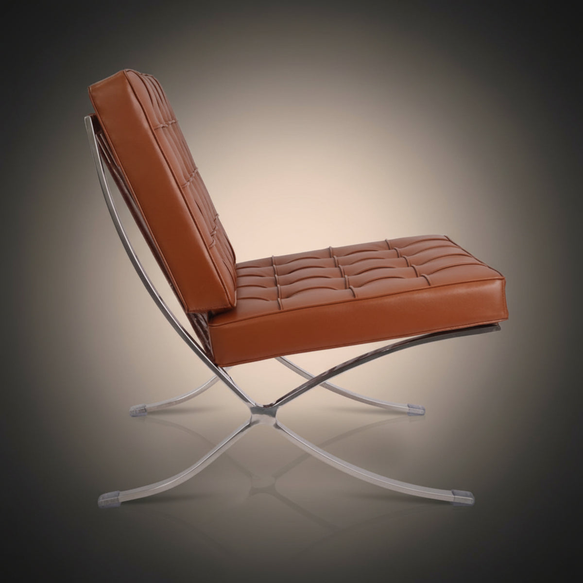 A modern Barcelona-style accent chair with tufted cognac brown leather upholstery and a chrome steel X-frame base