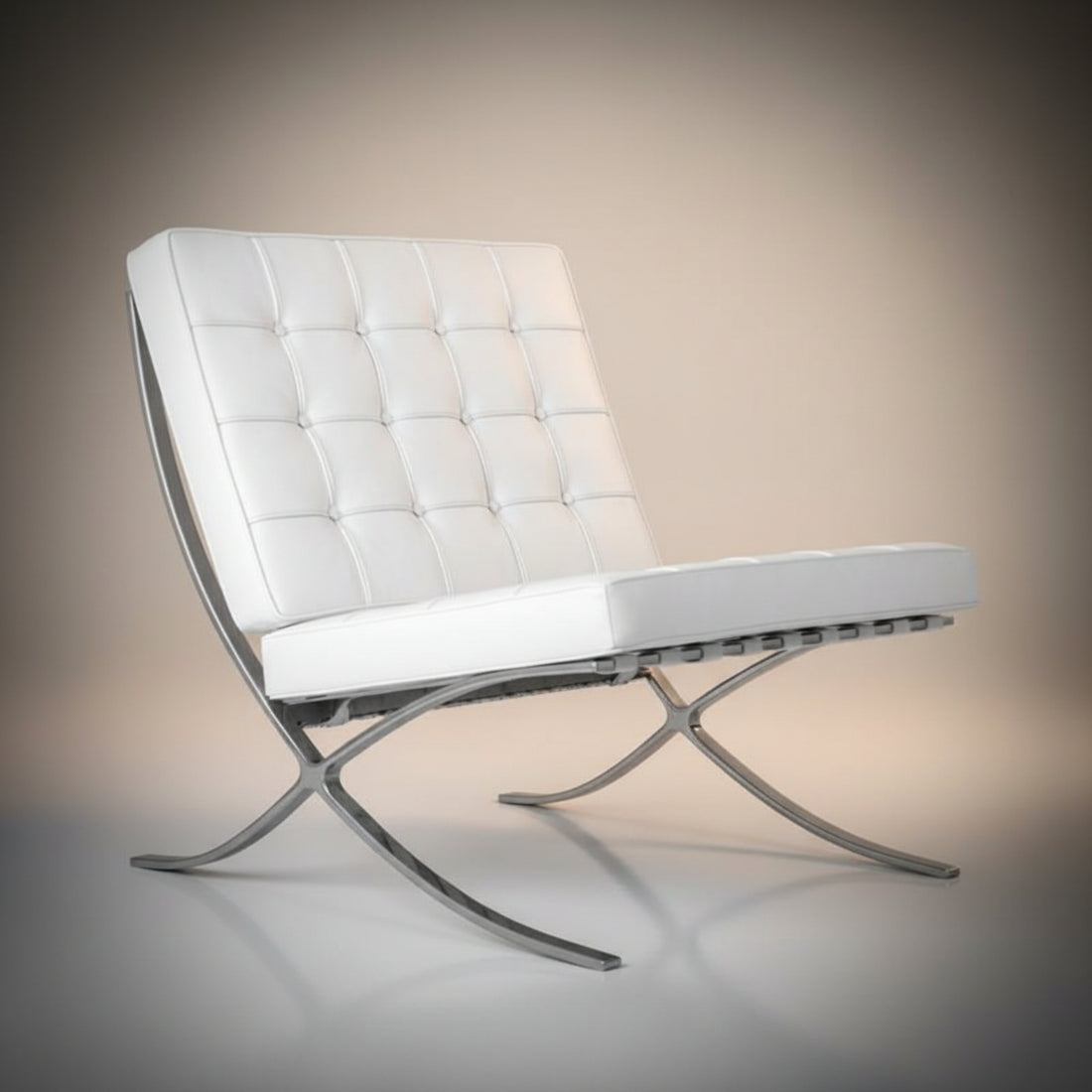 A modern white tufted lounge chair with a matching ottoman, both featuring curved silver metal legs.