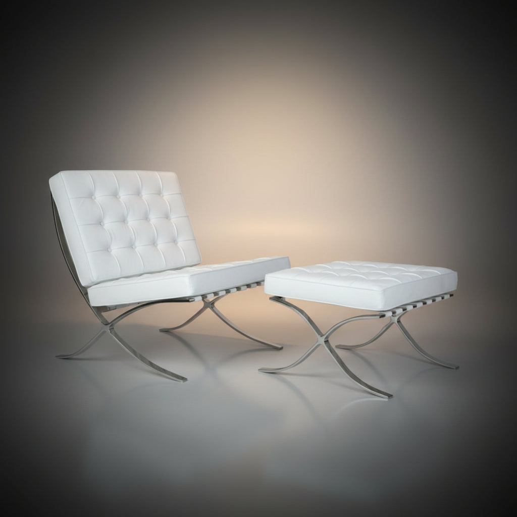 A modern white tufted leather chair with a matching ottoman, both supported by chrome S-shaped metal legs
