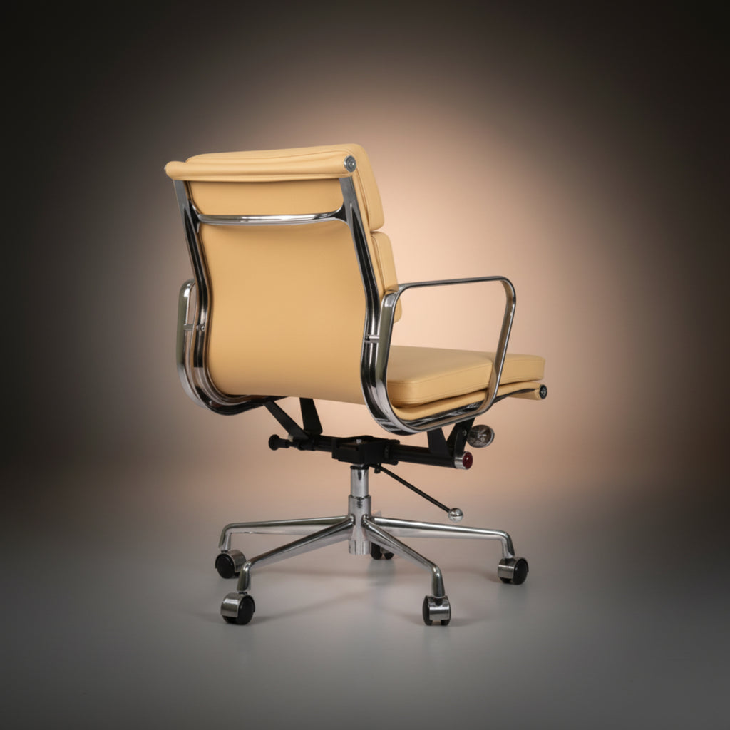 A modern office chair with a light beige leather seat and backrest, supported by a polished chrome metal frame