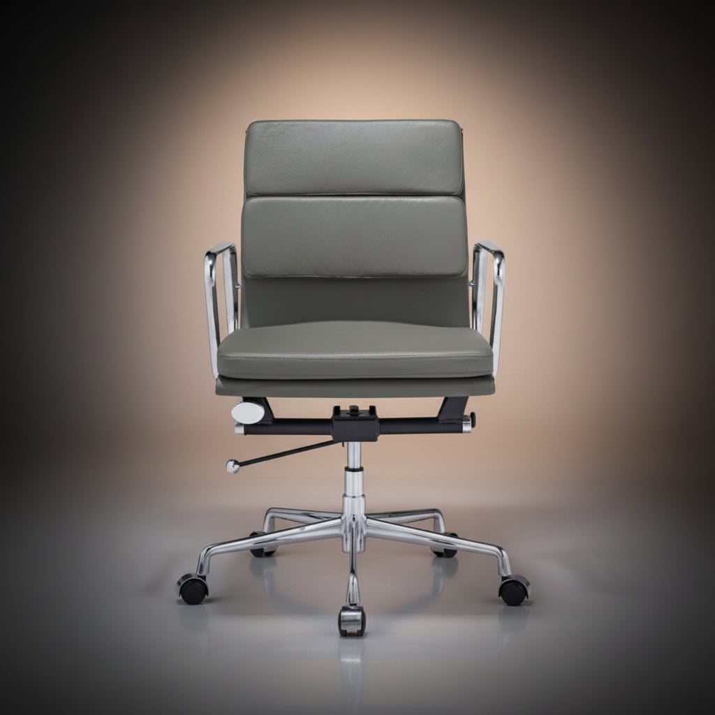 A modern office chair with a gray upholstered seat and backrest, supported by a chrome five-star base