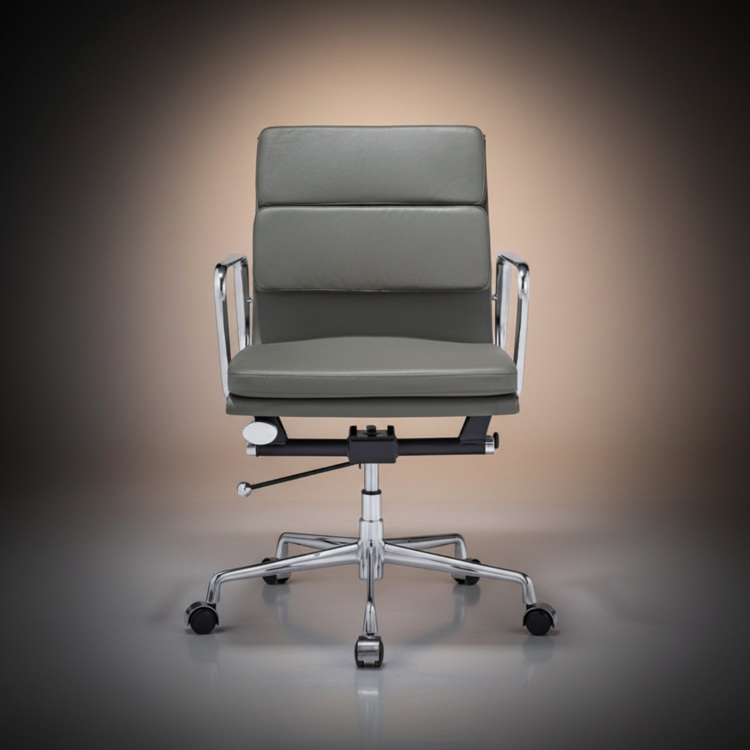 A modern office chair with a gray upholstered seat and backrest, supported by a chrome five-star base