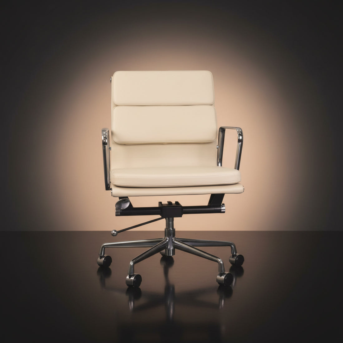 An off-white leather office chair with a high segmented backrest and chrome armrests Eames_Insired_Soft_Pad_Ea217_Soft_Pad_Ivory_White_1