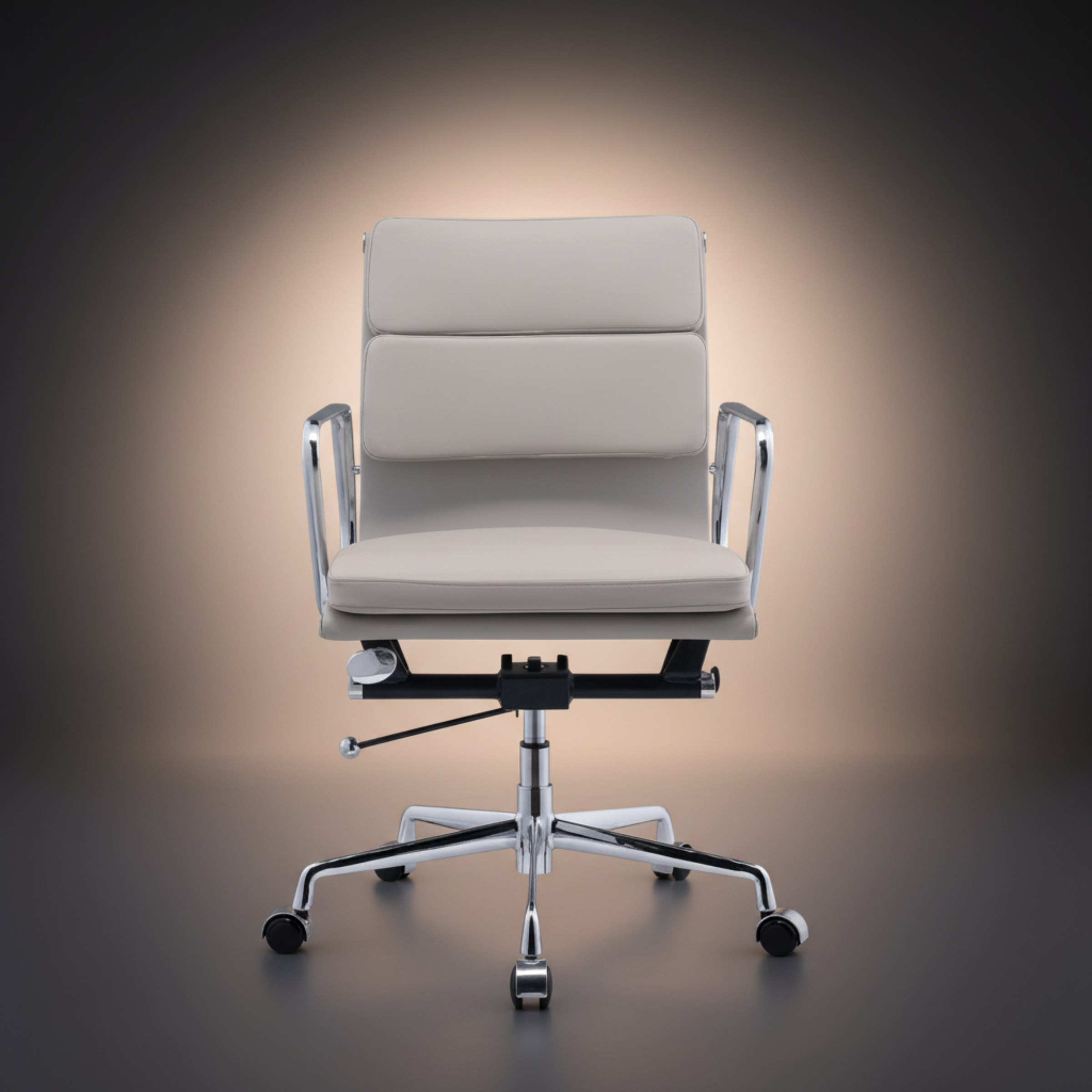 A modern office chair with a light beige upholstered seat and backrest, chrome metal armrests and base