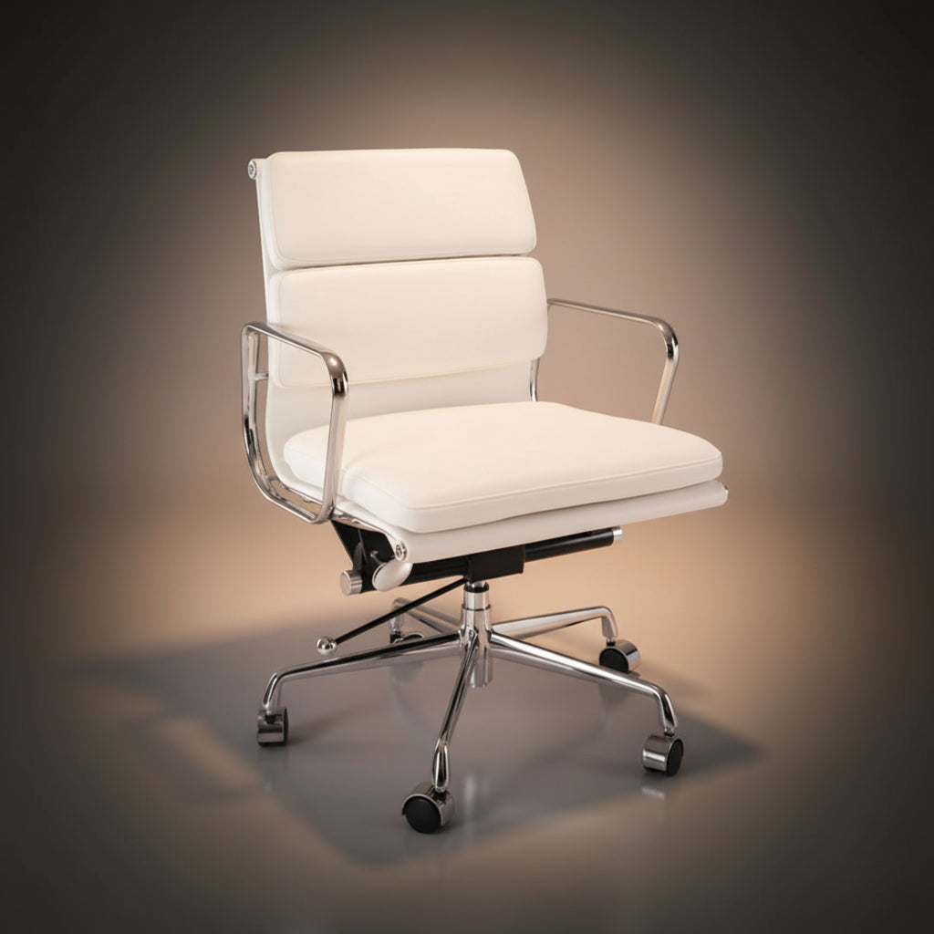 A modern white leather office chair with chrome metal armrests and a five-star wheeled base