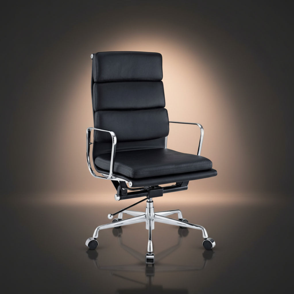 A modern black leather office chair with a high segmented backrest, chrome armrests, and a chrome five-star wheeled base