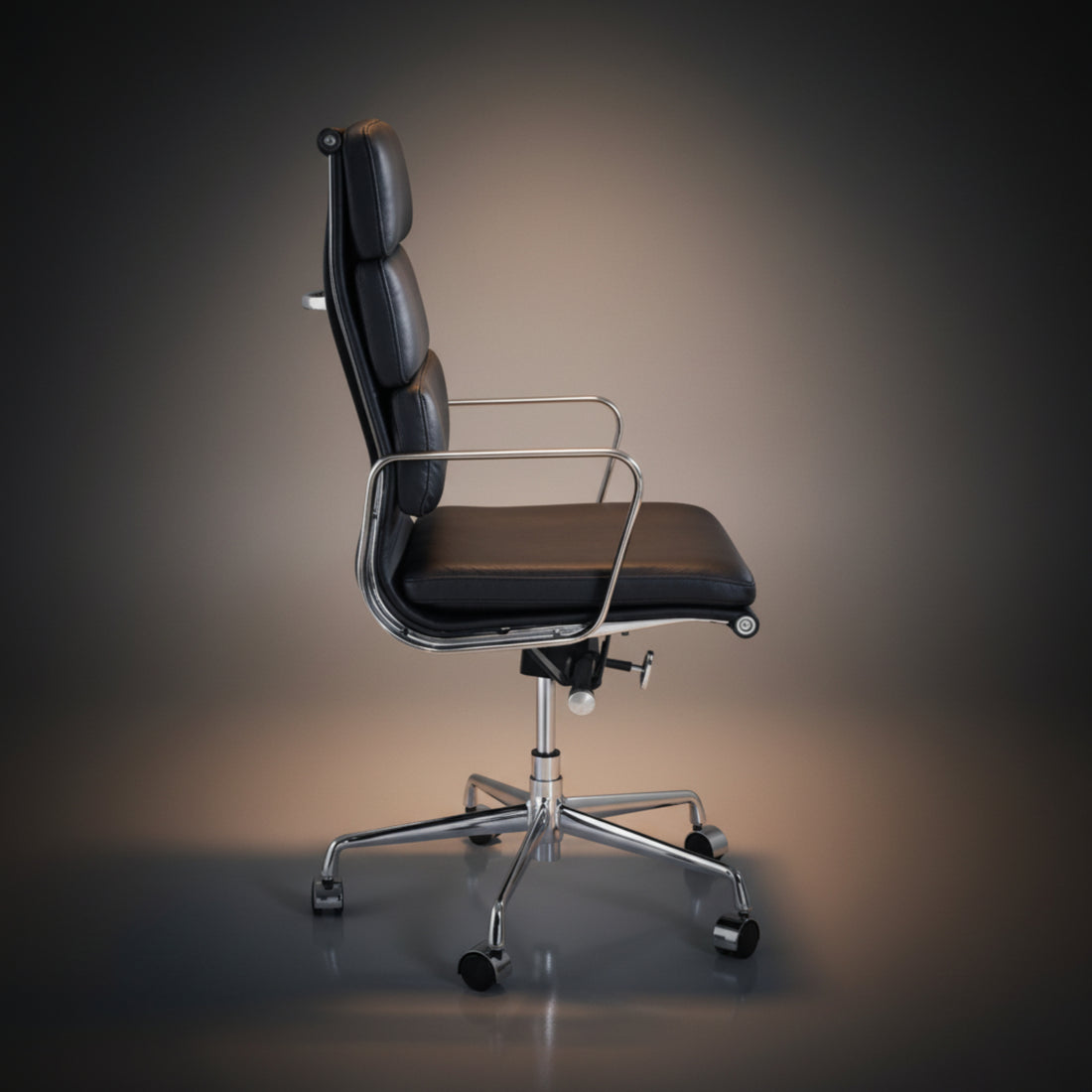 A modern black leather office chair with a high segmented backrest, chrome armrests, and a chrome five-star wheeled base