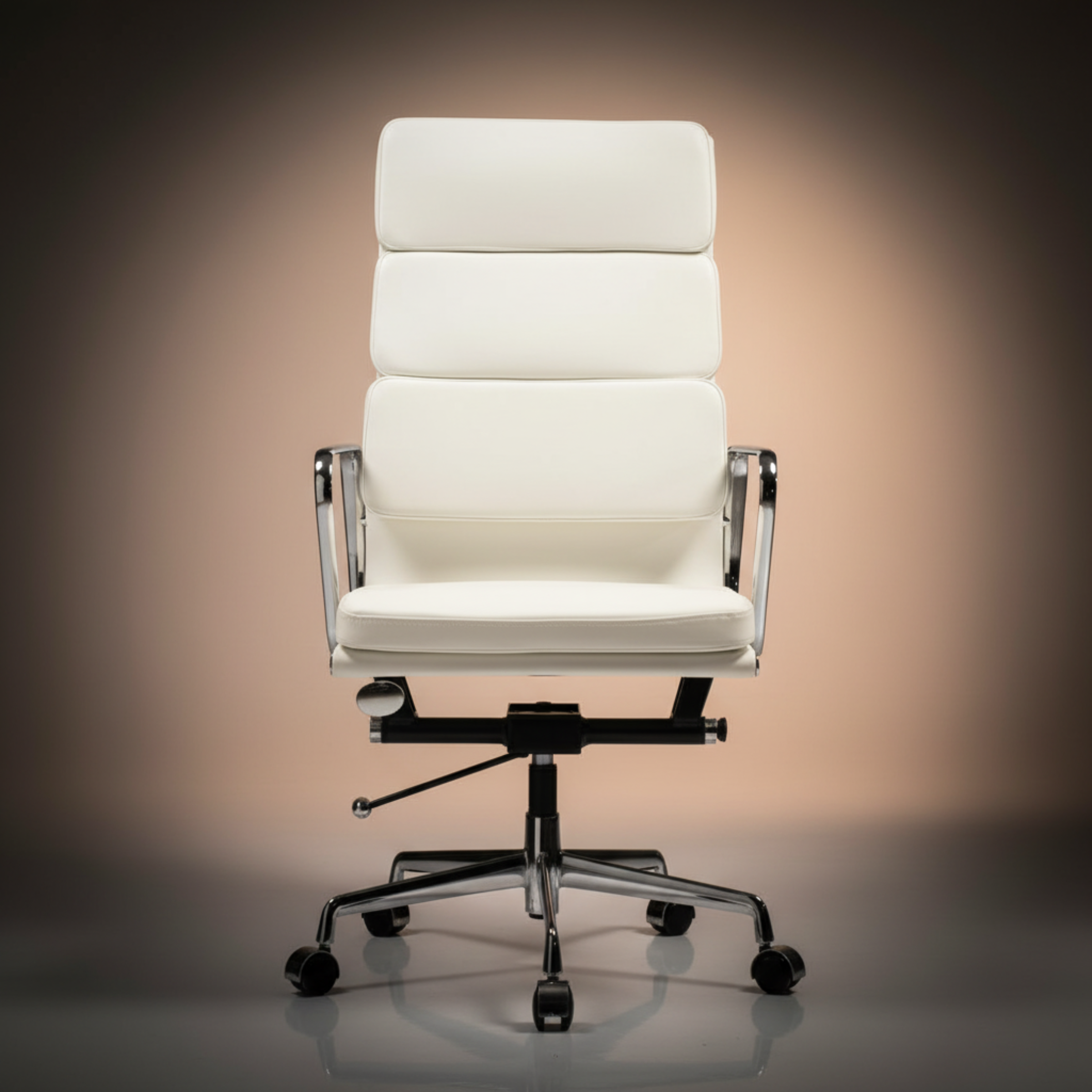 A modern high-back office chair upholstered in white leather, featuring a segmented backrest, chrome metal armrests