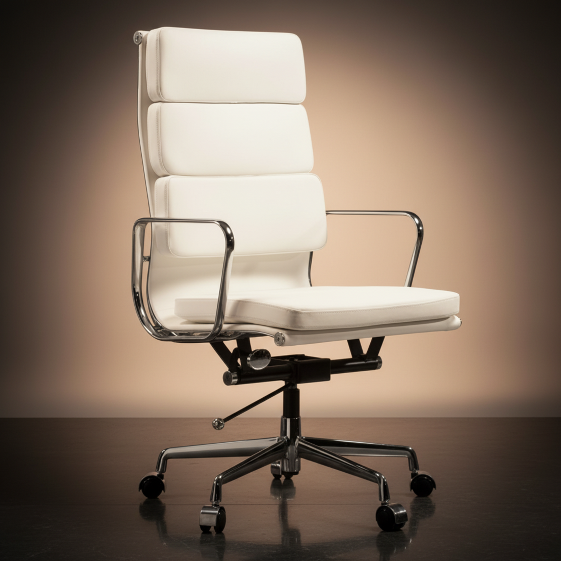 A modern high-back office chair upholstered in white leather, featuring a segmented backrest, chrome metal armrests