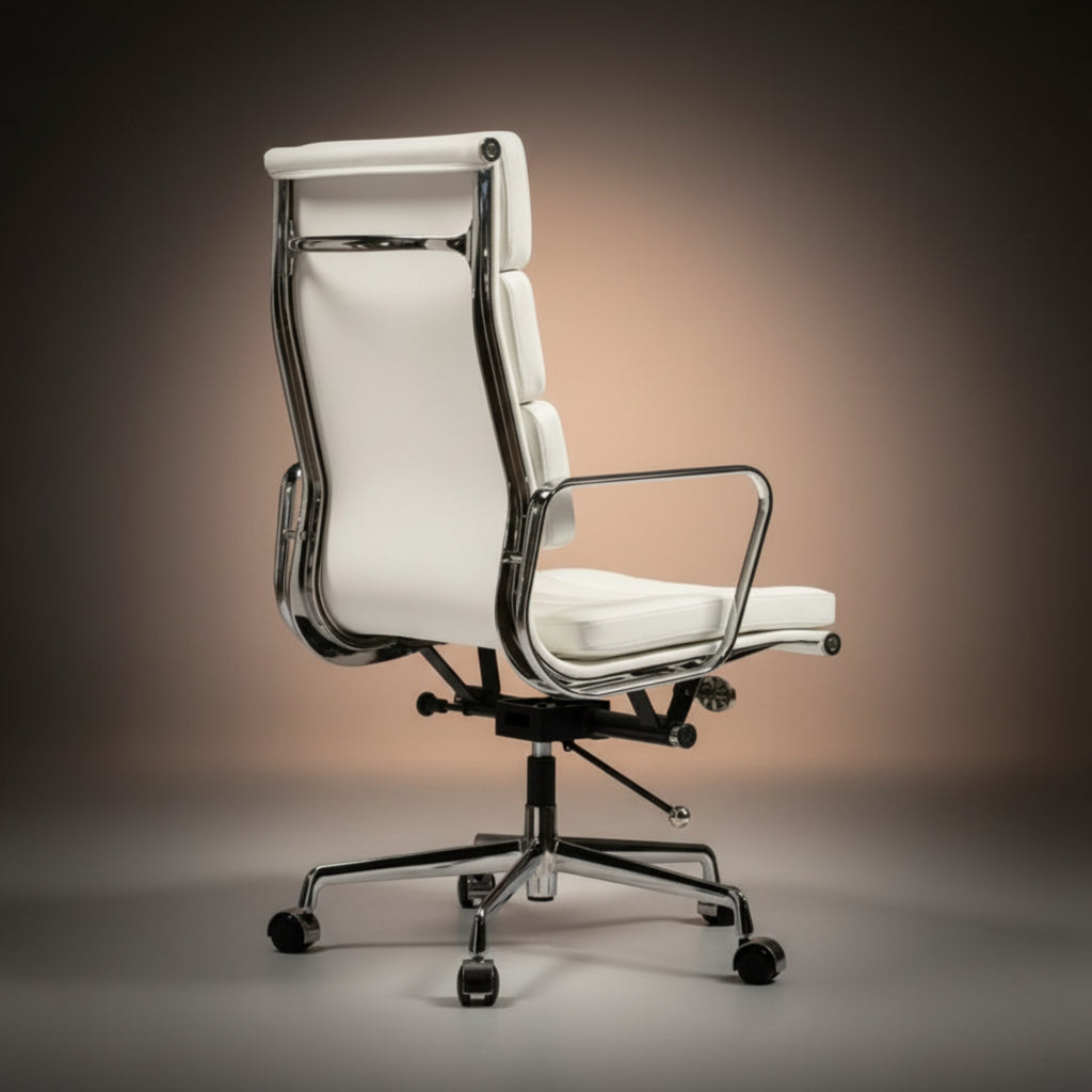 A modern white leather office chair with a chrome metal frame and black five-star base