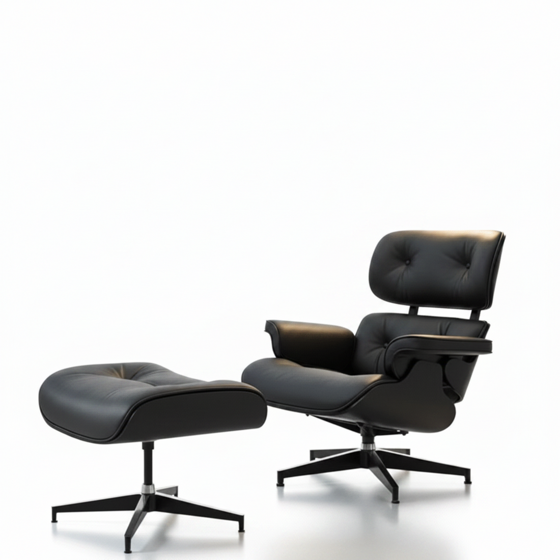 Black leather lounge chair and ottoman on a white background