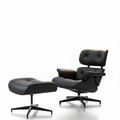 Black leather lounge chair and ottoman on a white background