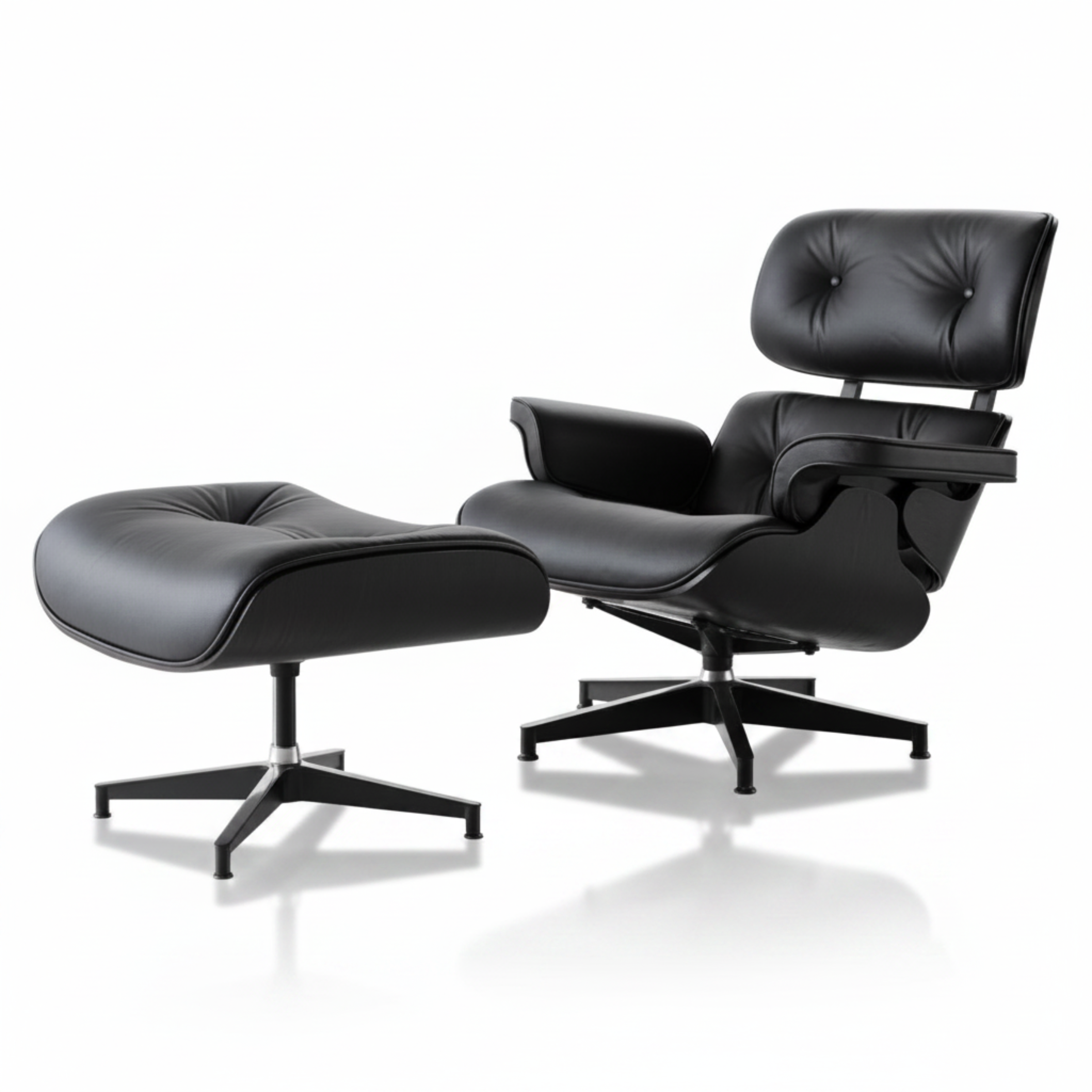 Black leather lounge chair and ottoman on a white background