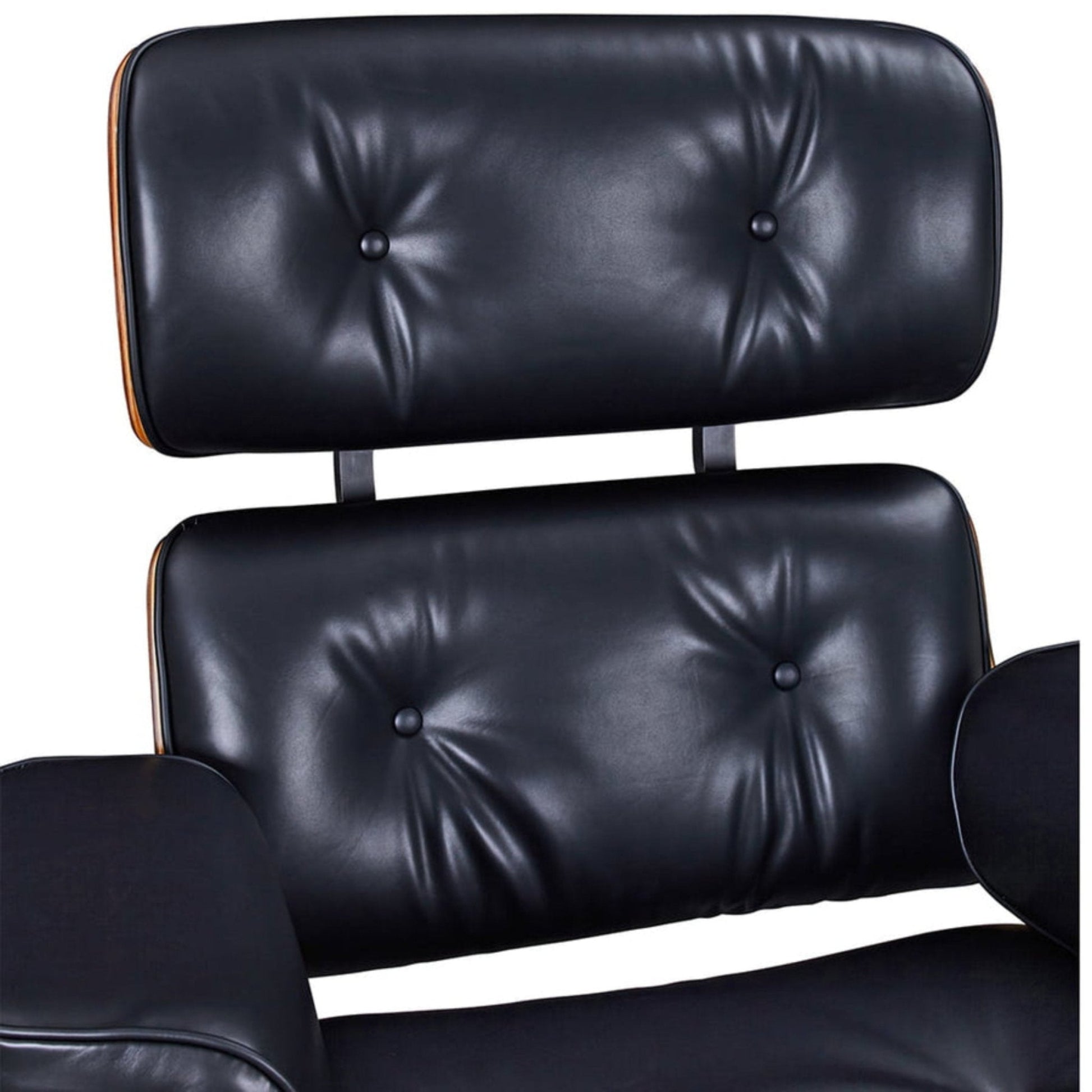 Black leather chair with buttoned backrest on a white background