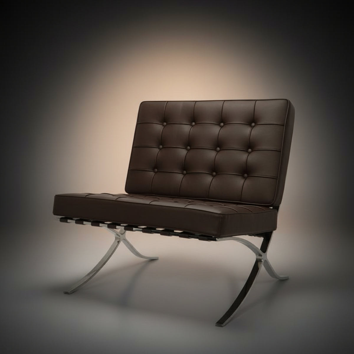 A modern tufted leather armchair in dark brown with a curved chrome metal base, photographed 