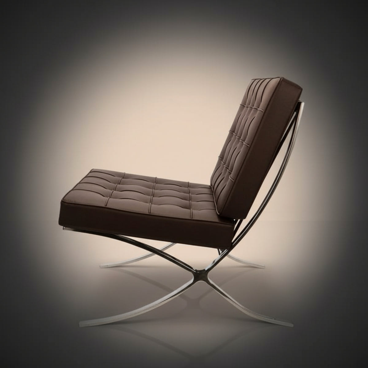 A modern brown tufted leather lounge chair with a chrome X-frame base, shown from a three-quarters angle 