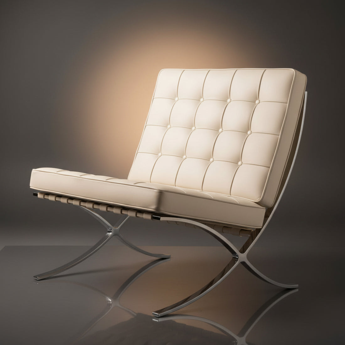 A modern tufted leather armchair with a chrome metal frame, shown on a dark gray reflective studio