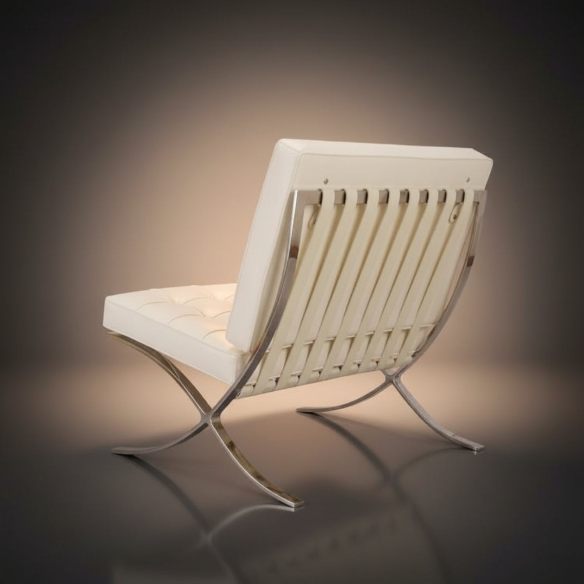 A modern lounge chair with a white tufted seat and backrest, featuring vertical chrome slats and an X-shaped chrome base