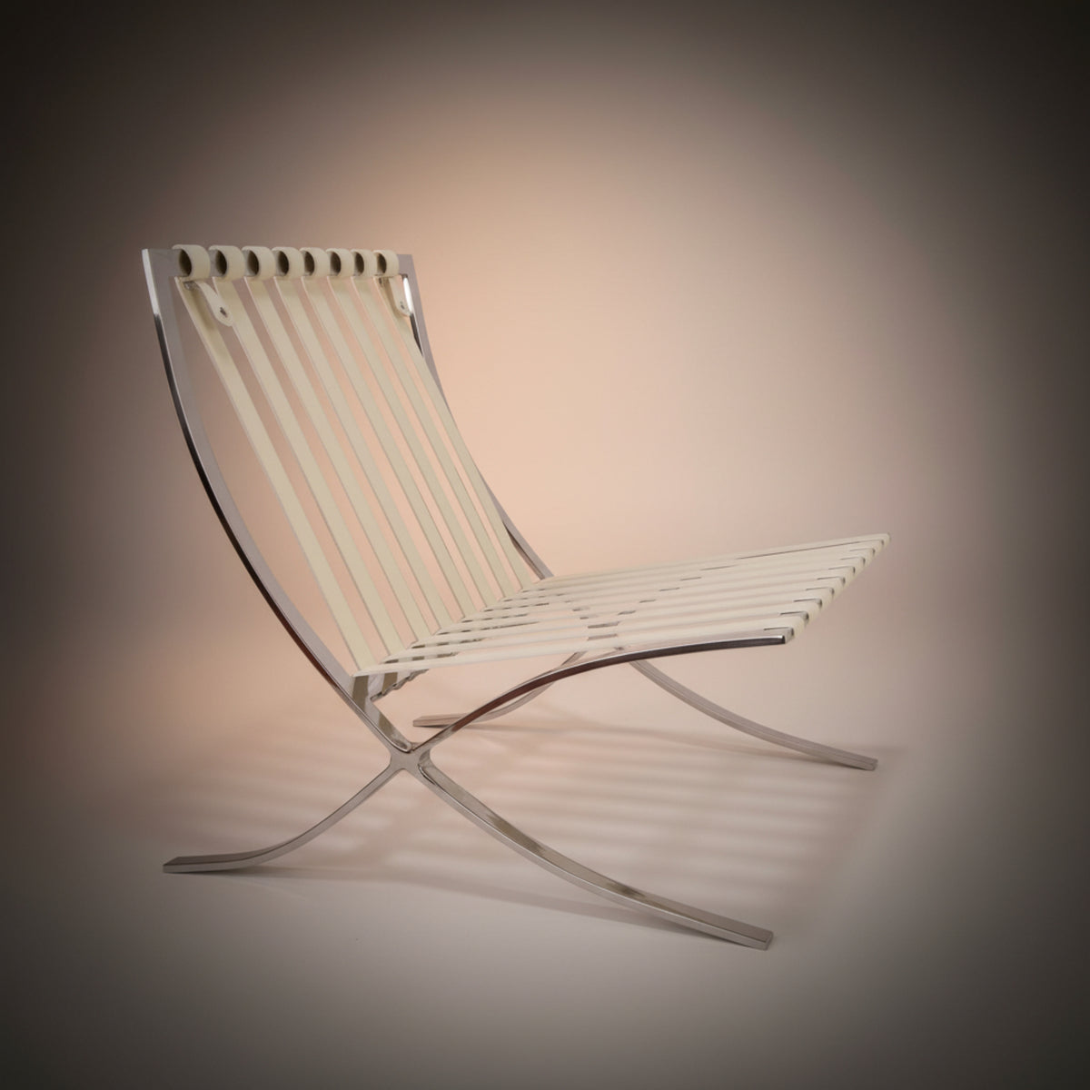 A modern Barcelona-style chair with a curved chrome metal frame and off-white woven seat and back slats, shown on a dark gray vignette background.
