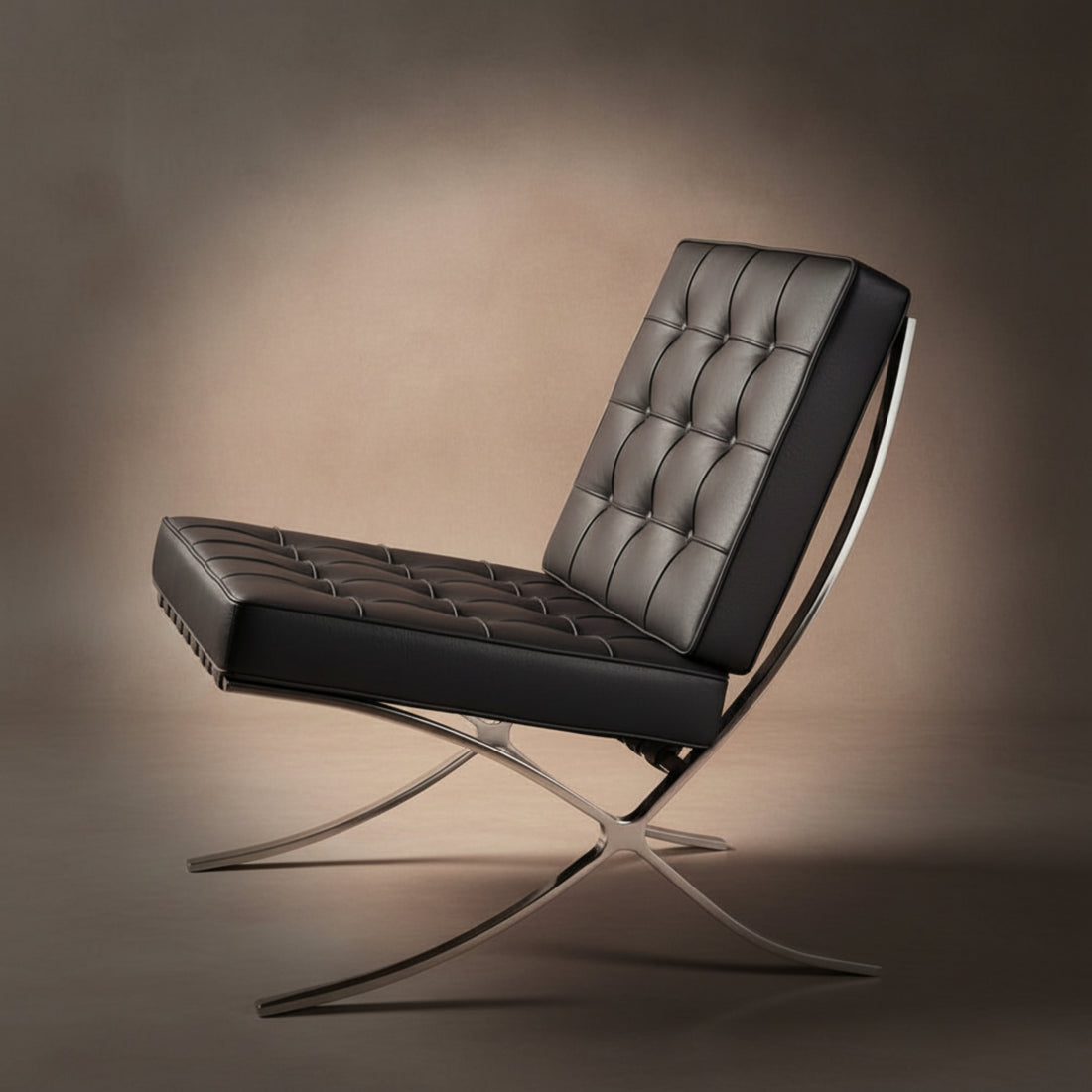 A modern black leather armchair with a tufted button-backrest and curved metallic legs, shown on a dark reflective floor 