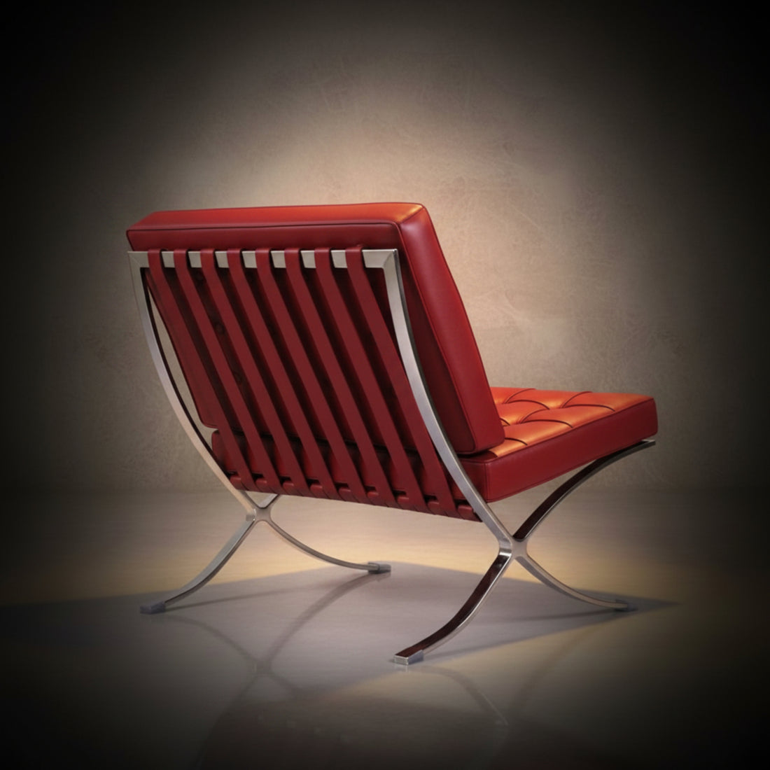 A modern Barcelona-style armchair with deep tufted red leather upholstery and curved chrome metal legs