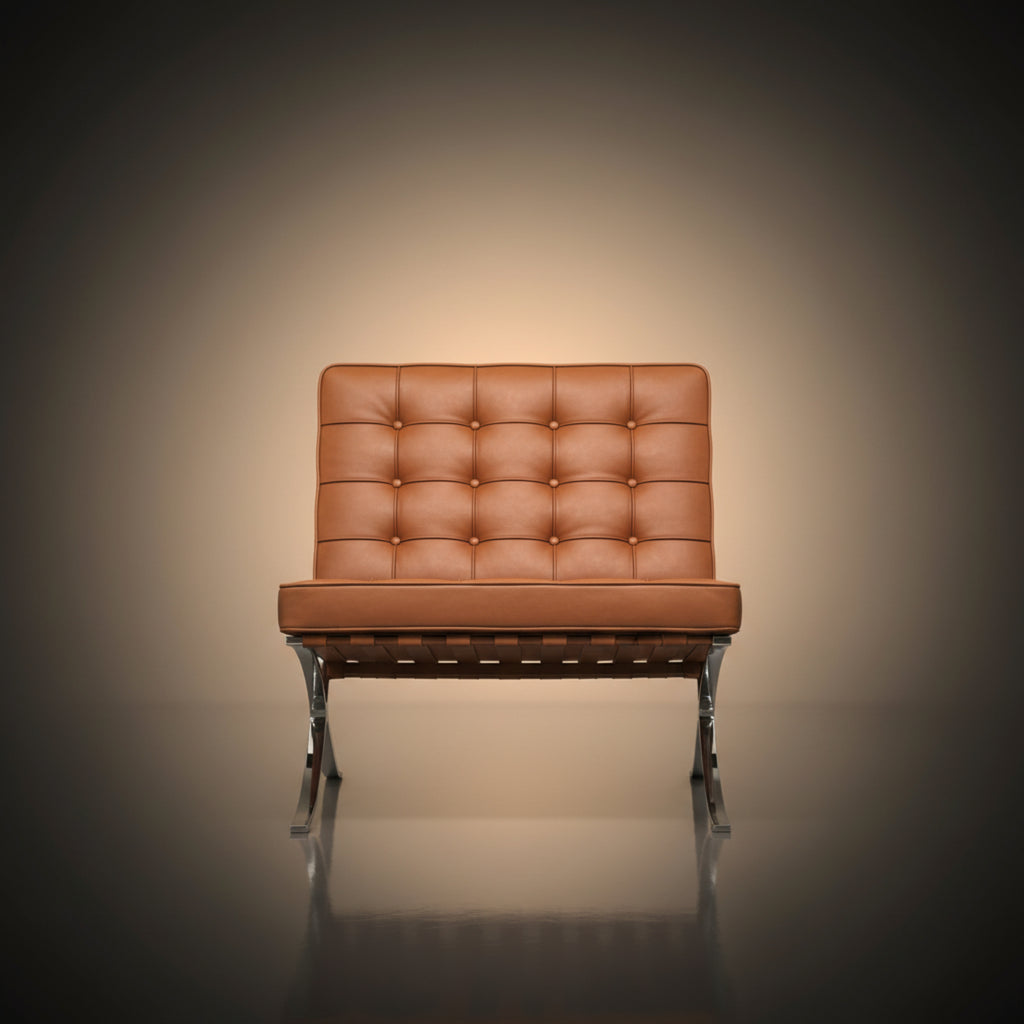 A modern leather armchair with a tufted backrest and chrome legs, centered