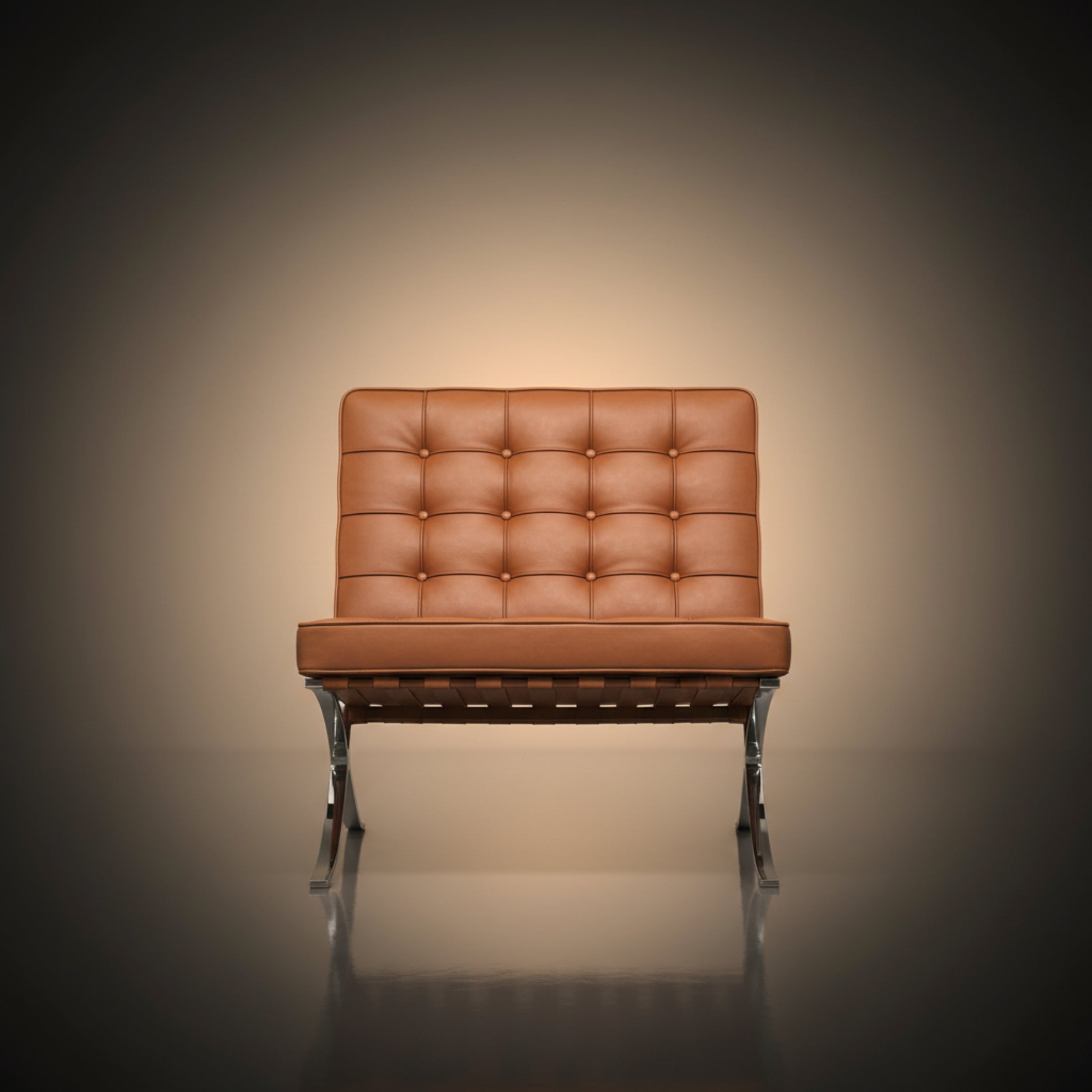 A modern leather armchair with a tufted backrest and chrome legs, centered