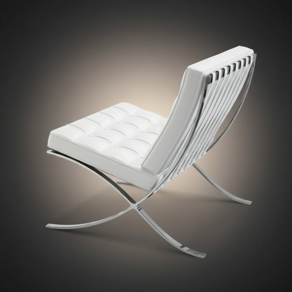 A modern white leather lounge chair with a curved chrome metal frame, shown from a three-quarters angle 