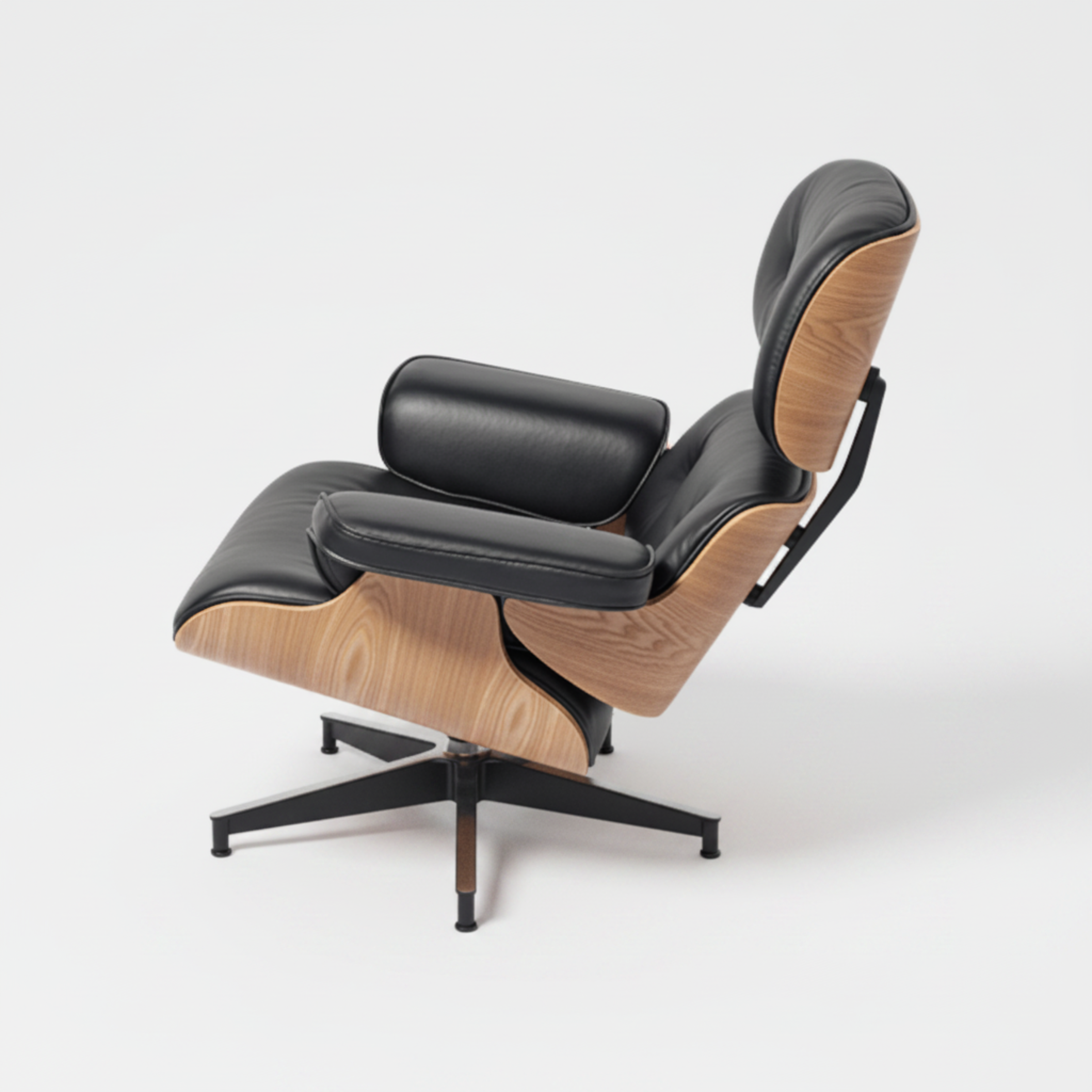 A modern lounge chair with black leather upholstery and light natural wood side panels