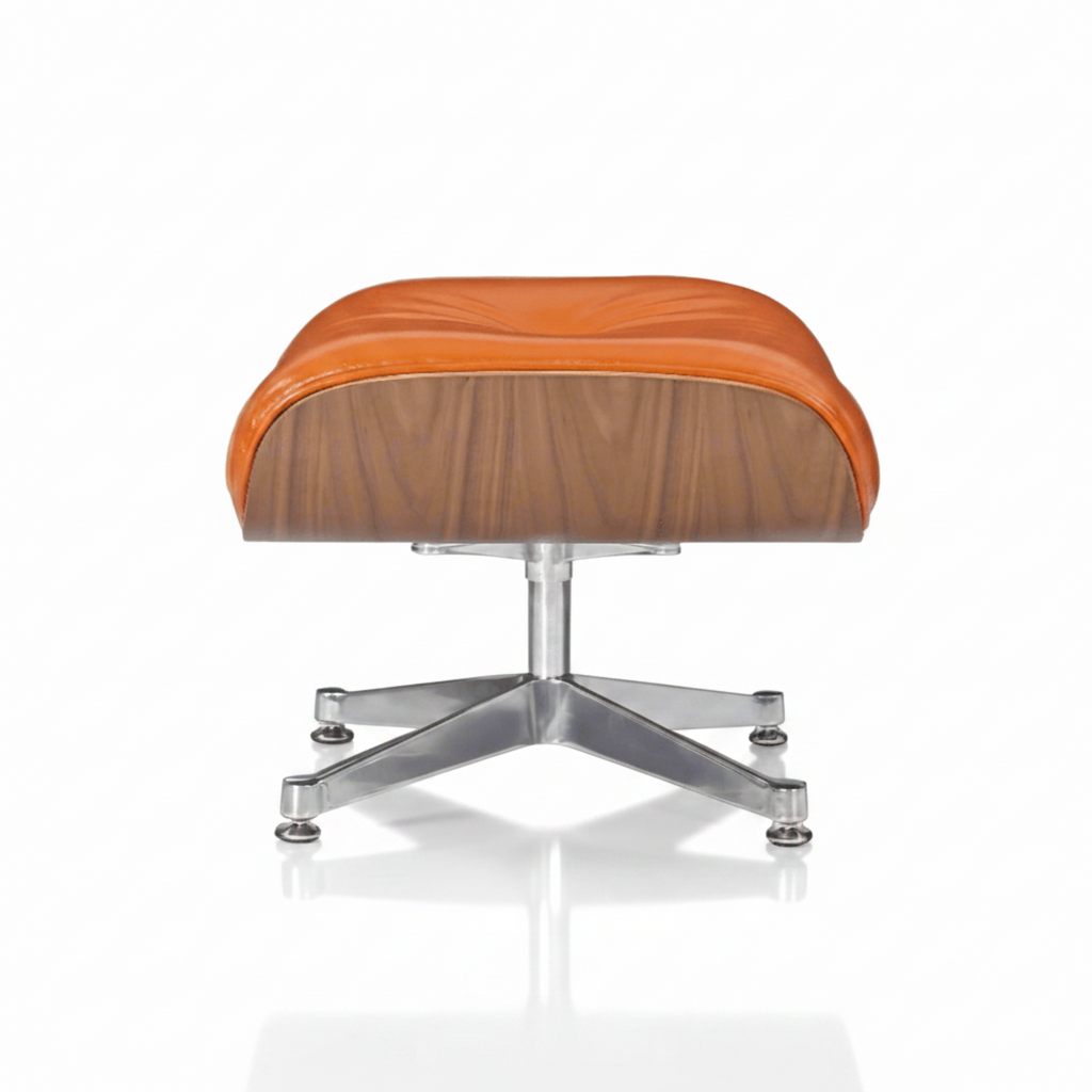 An Eames-style lounge chair and ottoman set with a warm orange-brown leather seat, a wood-grain shell, and a chrome metal base, shown on a white background with a soft reflection.
