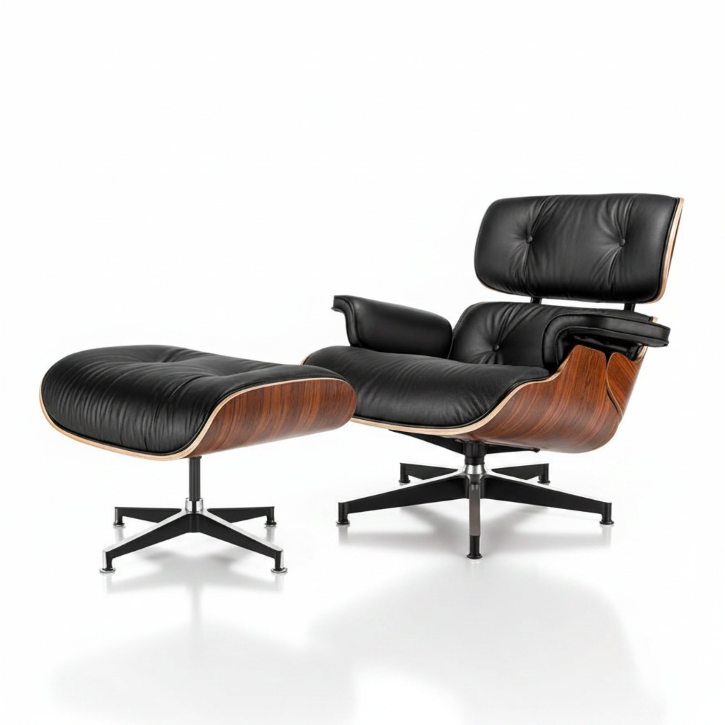 Black leather lounge chair and ottoman with wooden accents on a white background