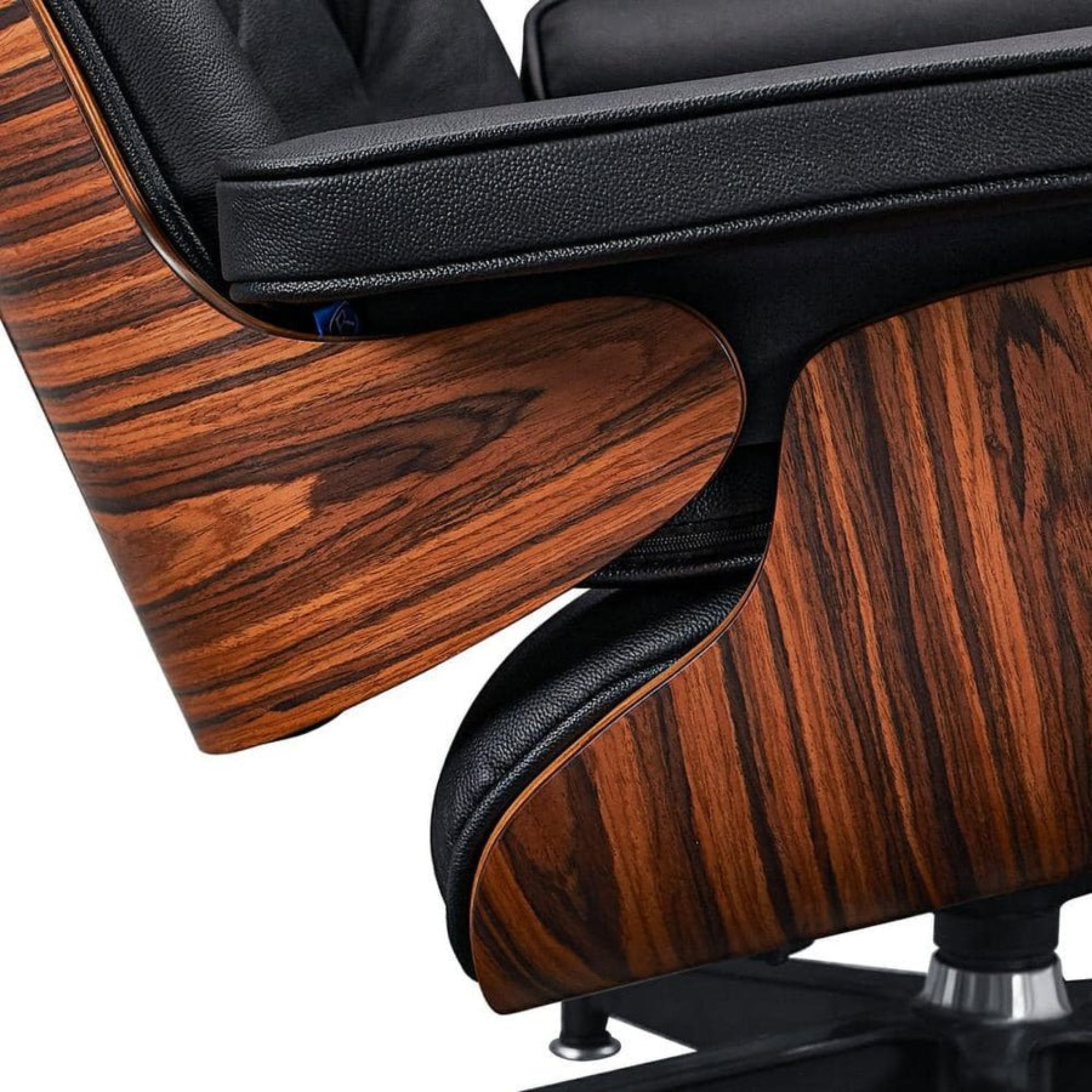 Close-up of a wooden and black chair with a white background