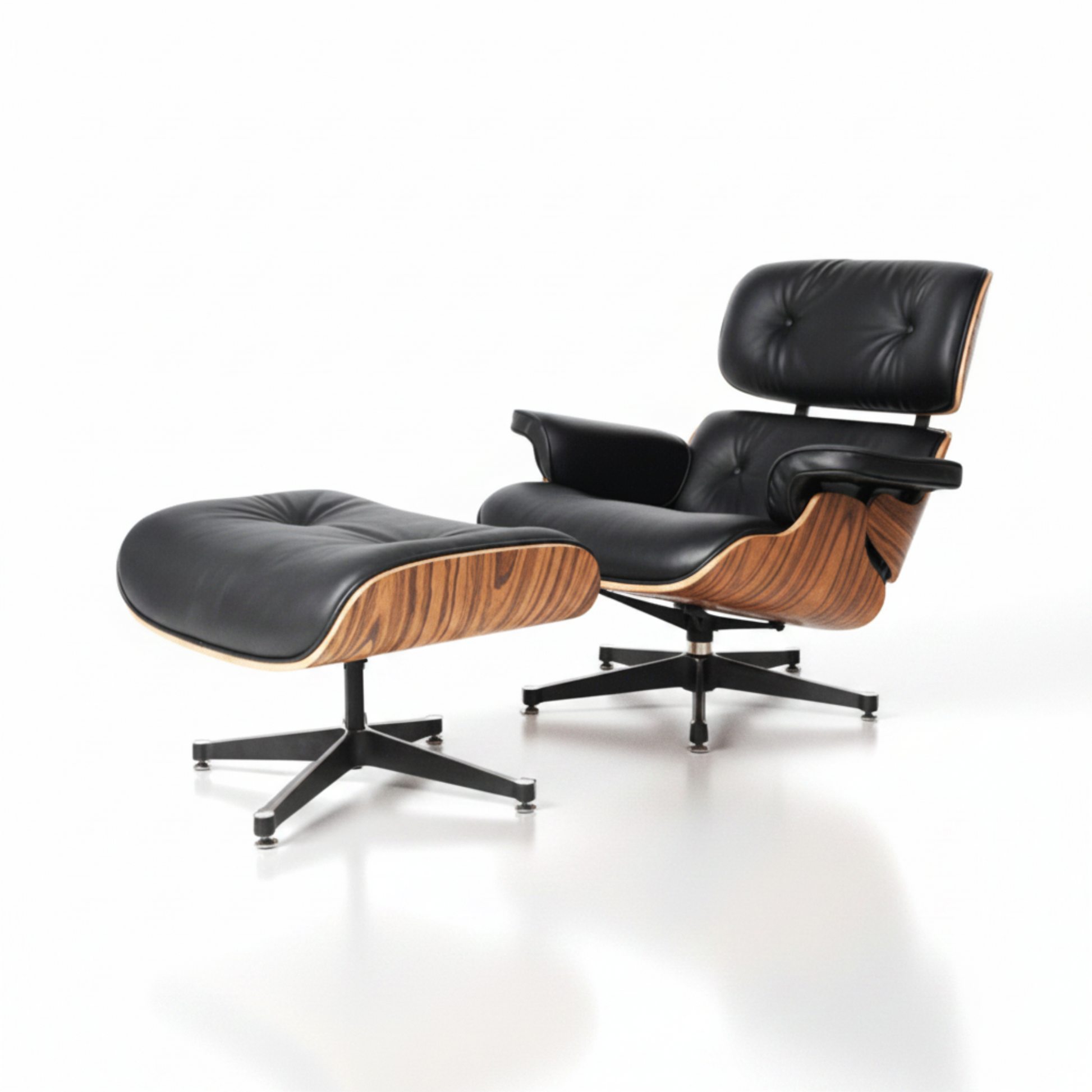 A modern lounge chair with an attached ottoman, featuring black leather upholstery