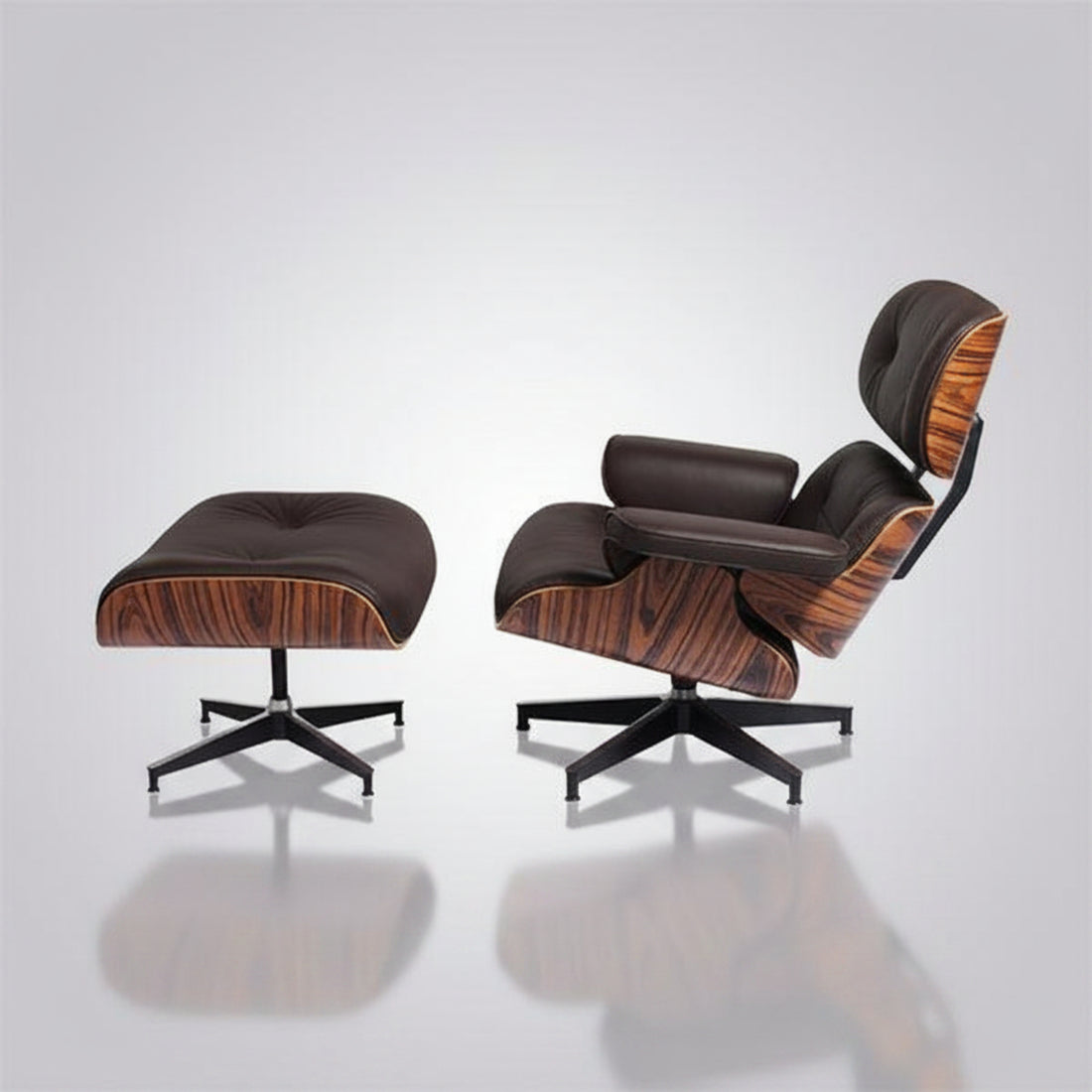 A classic Eames-style lounge chair with matching ottoman in dark brown leather and wood veneer