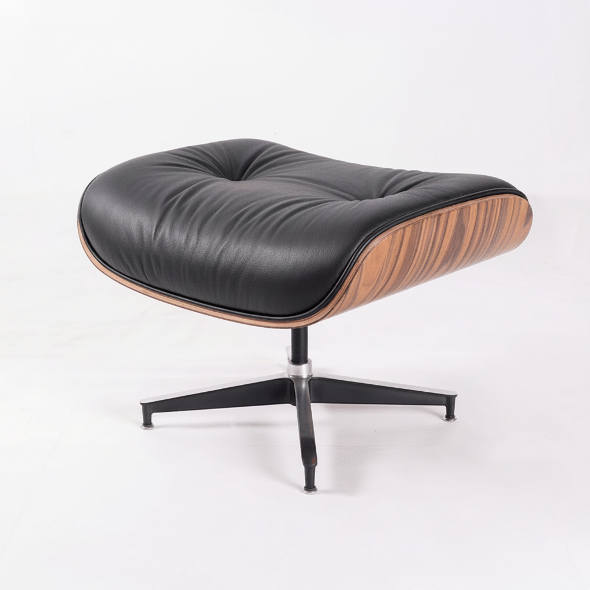 A modern lounge chair with a black leather cushion, a curved wood-grain side shell