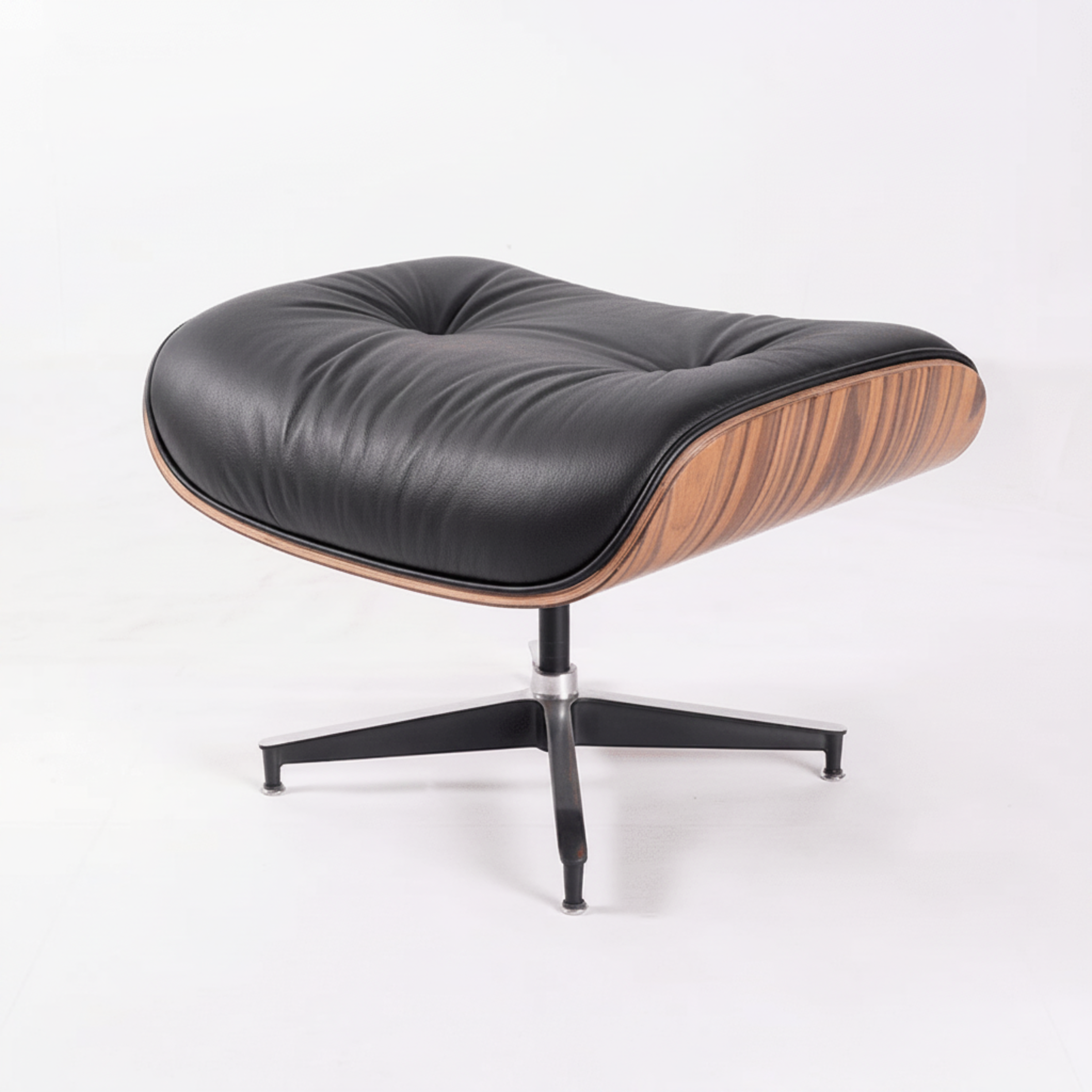 A modern lounge chair with a black leather cushion, a curved wood-grain side shell