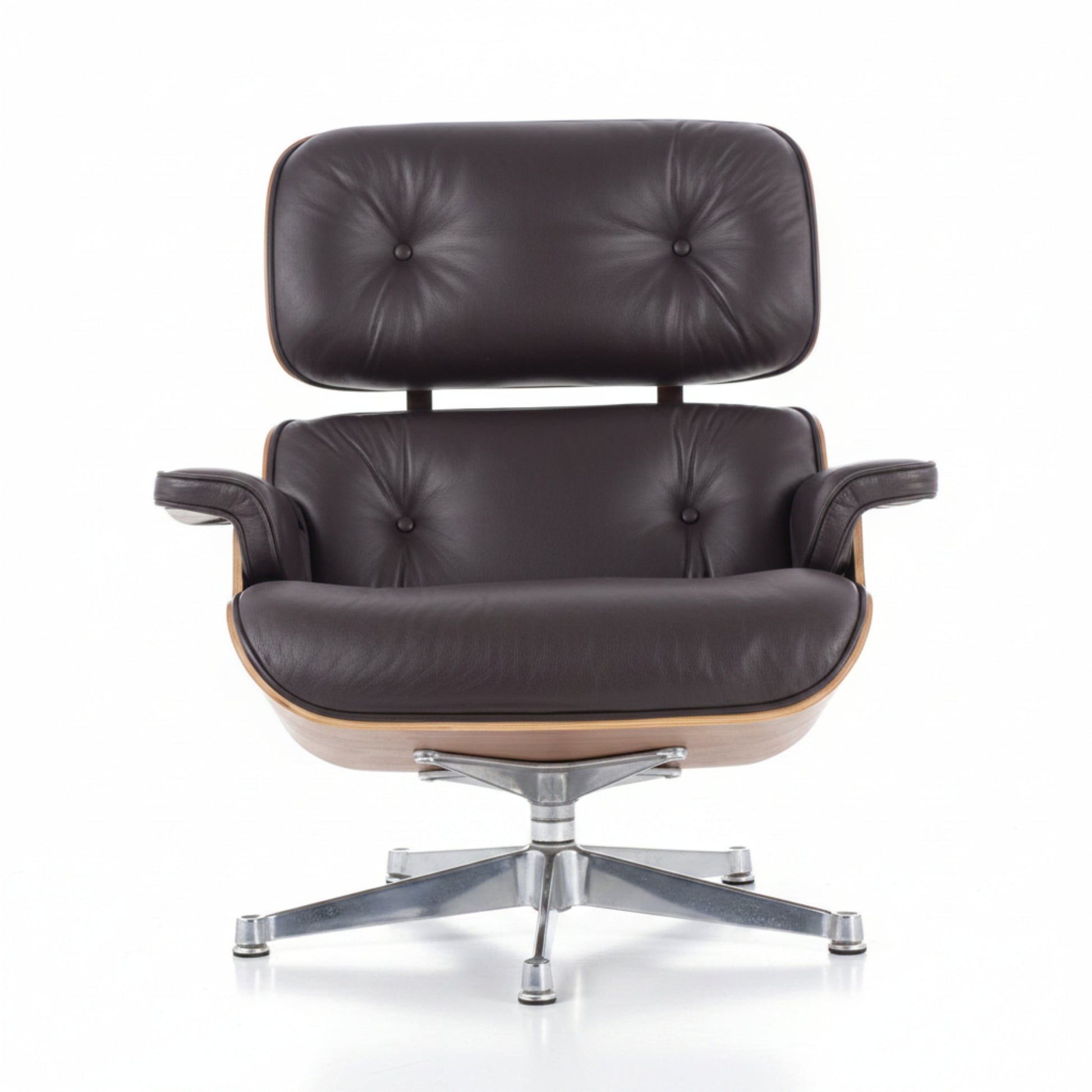 A classic mid-century modern lounge chair with dark brown tufted leather upholstery