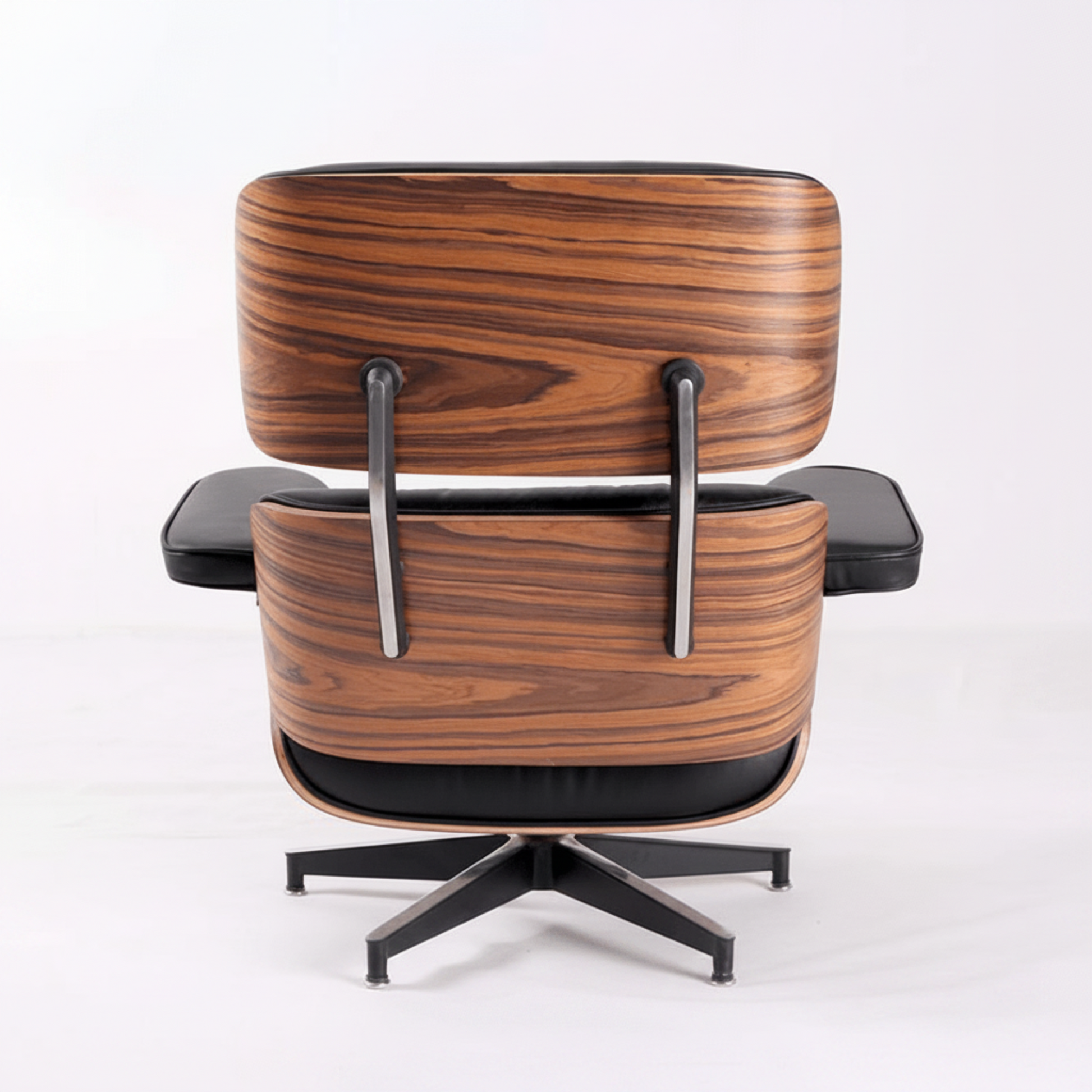 A modern lounge chair with a distinctive wavy wood grain pattern on the seat and back cushions, black leather