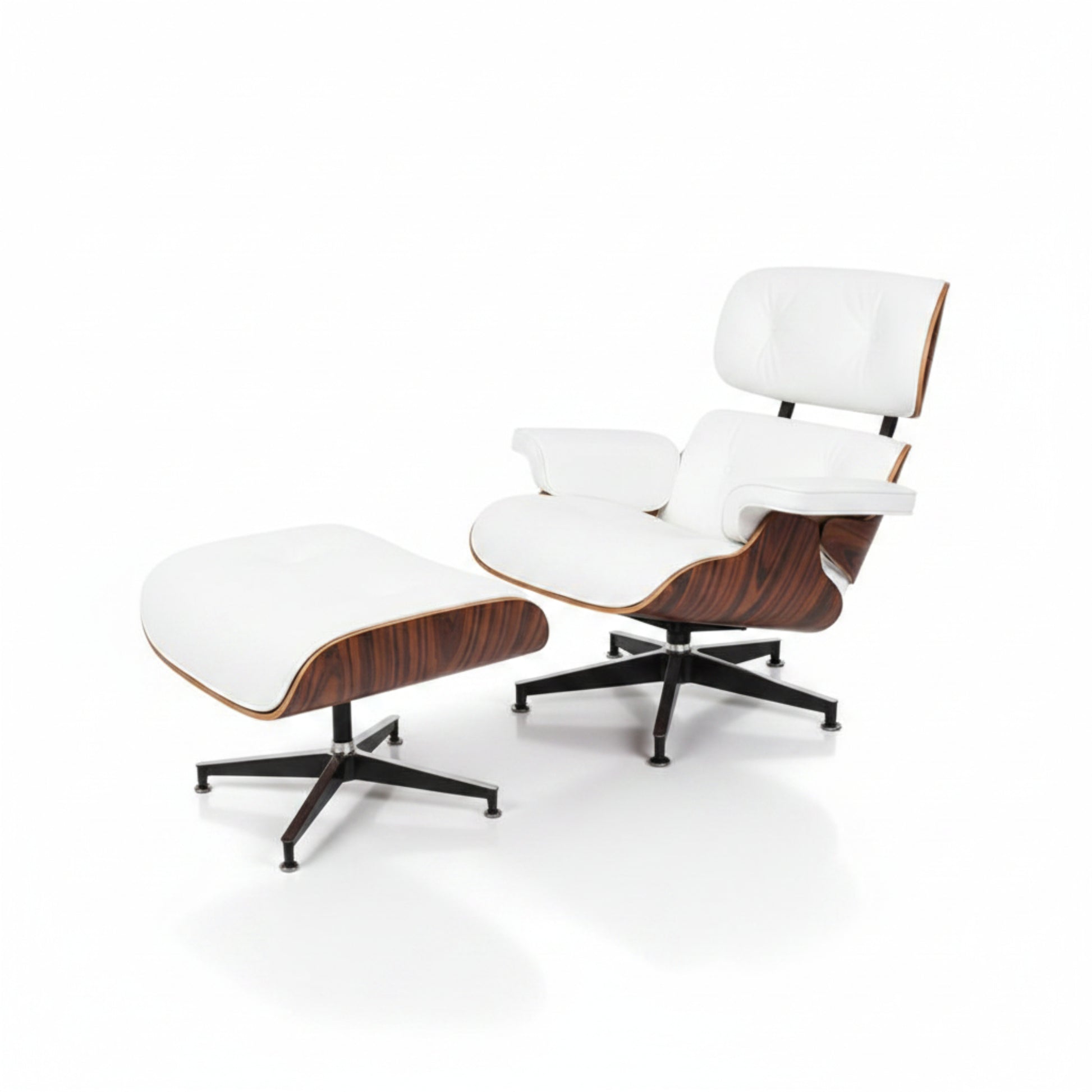 A mid-century modern lounge chair with an ottoman, featuring white leather upholstery, curved wood veneer shells