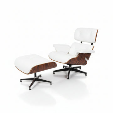 A mid-century modern lounge chair with an ottoman, featuring white leather upholstery, curved wood veneer shells