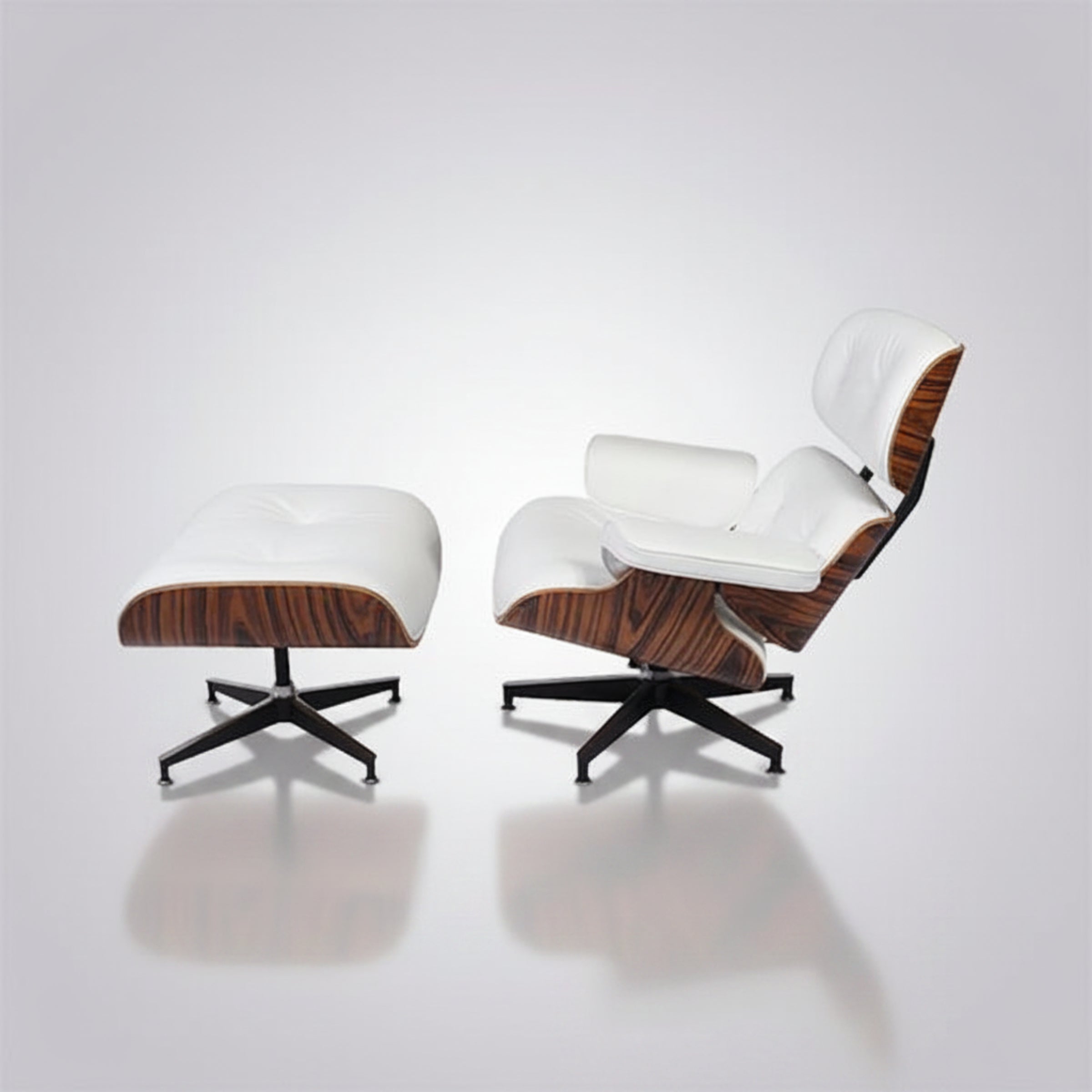 A modern lounge chair with matching ottoman on a light gray reflective studio background.