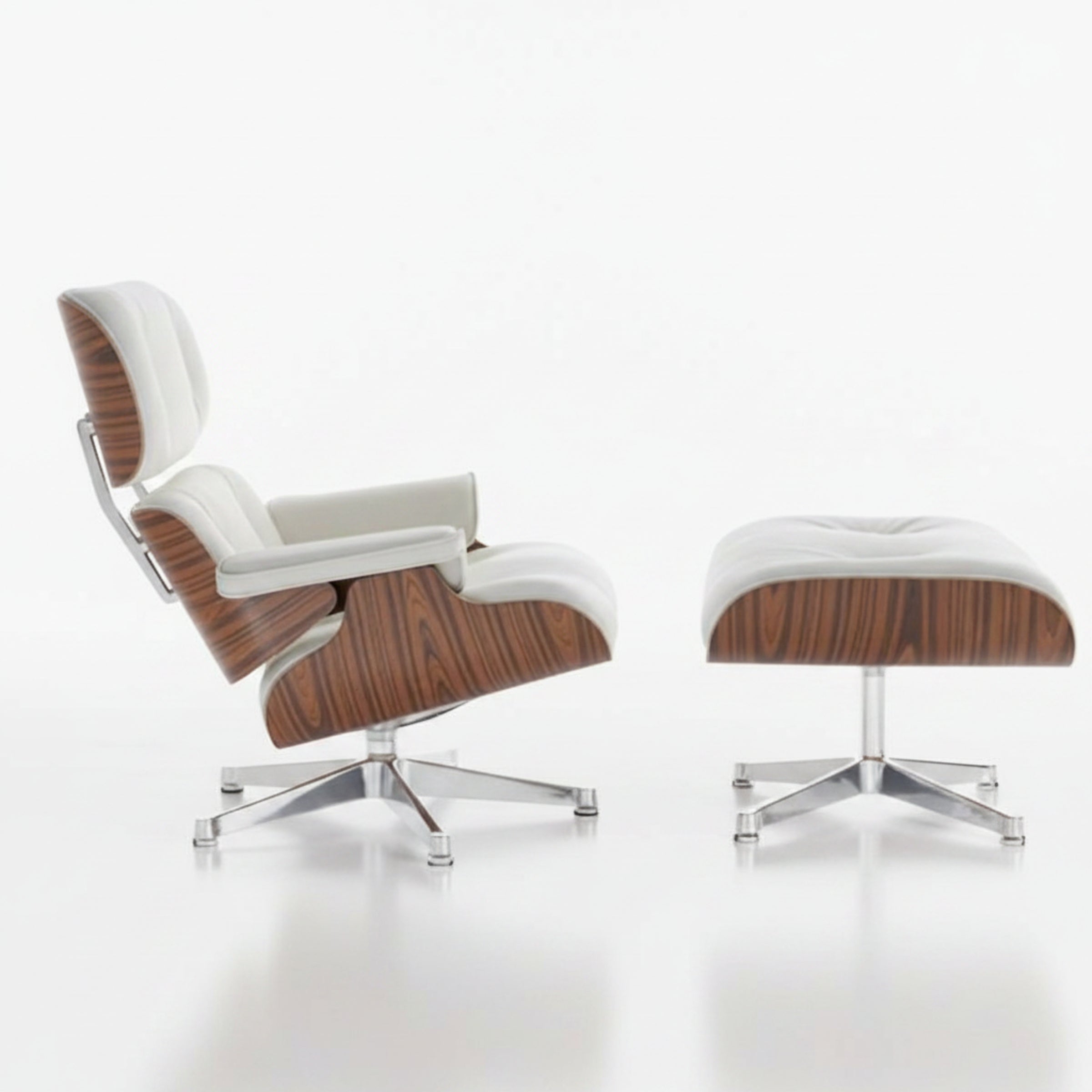 Black lounge chair and ottoman on a white background
