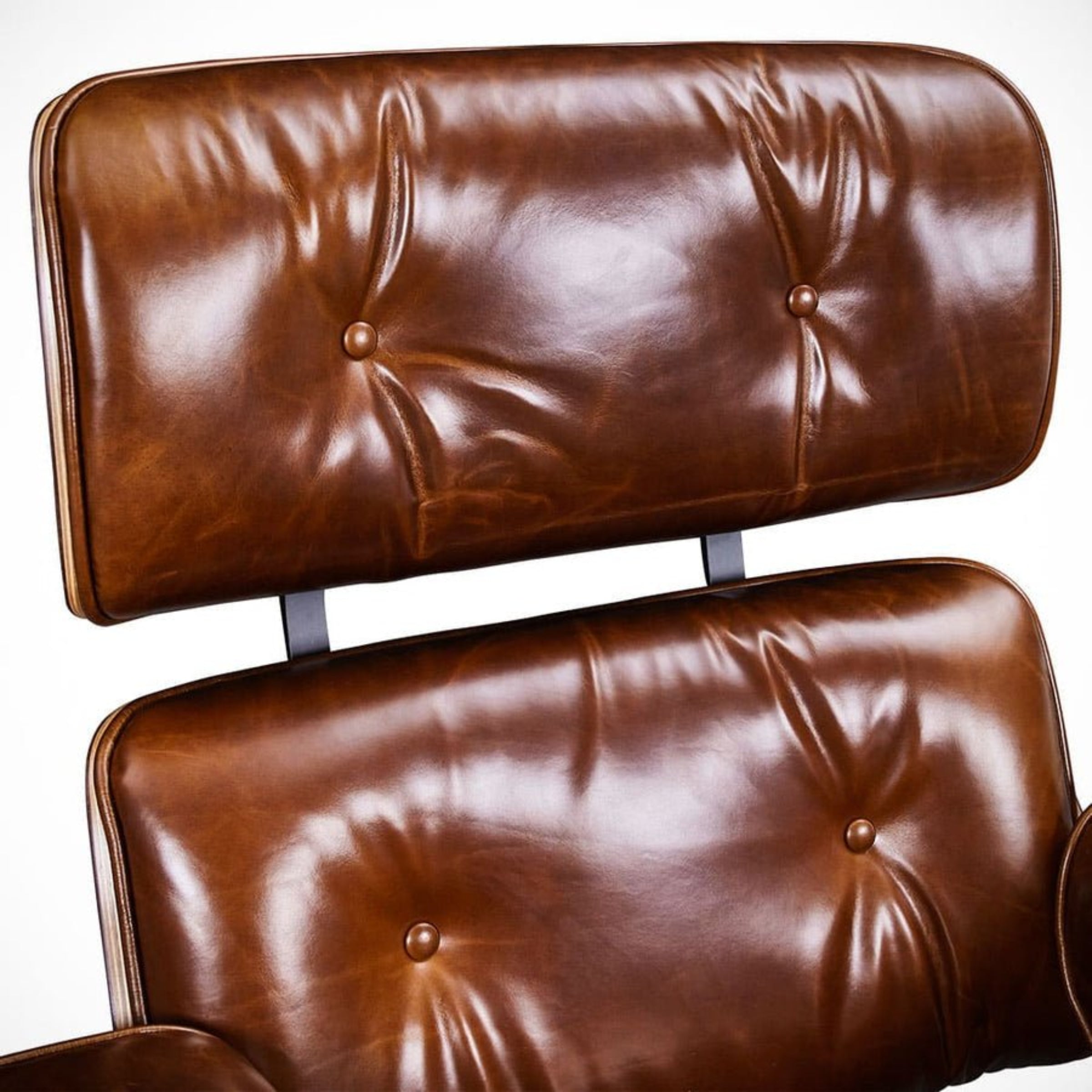 waxed Brown leather chair with tufted backrest and seat on a white background