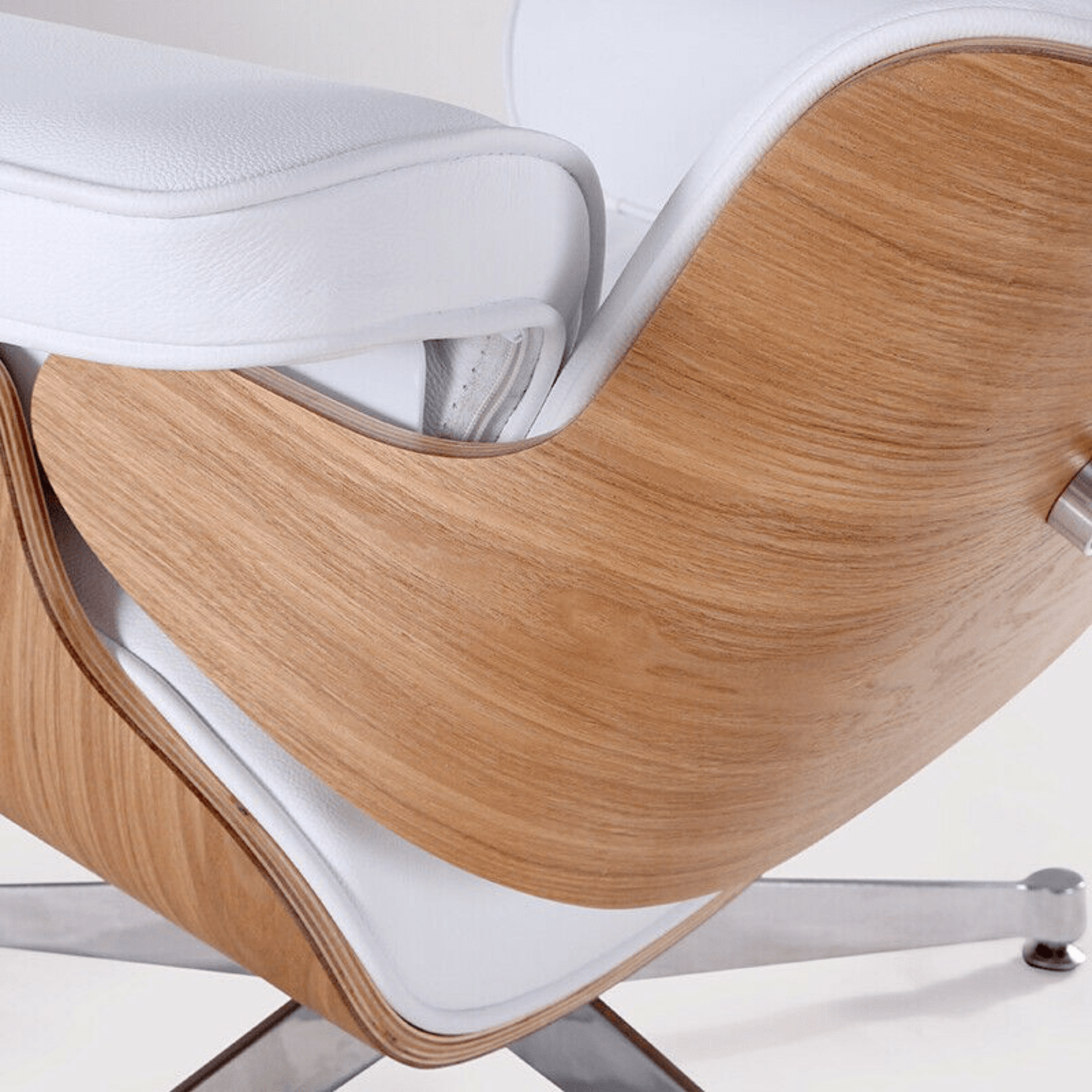 Close-up of a modern chair with wooden seat and white cushion on a white background