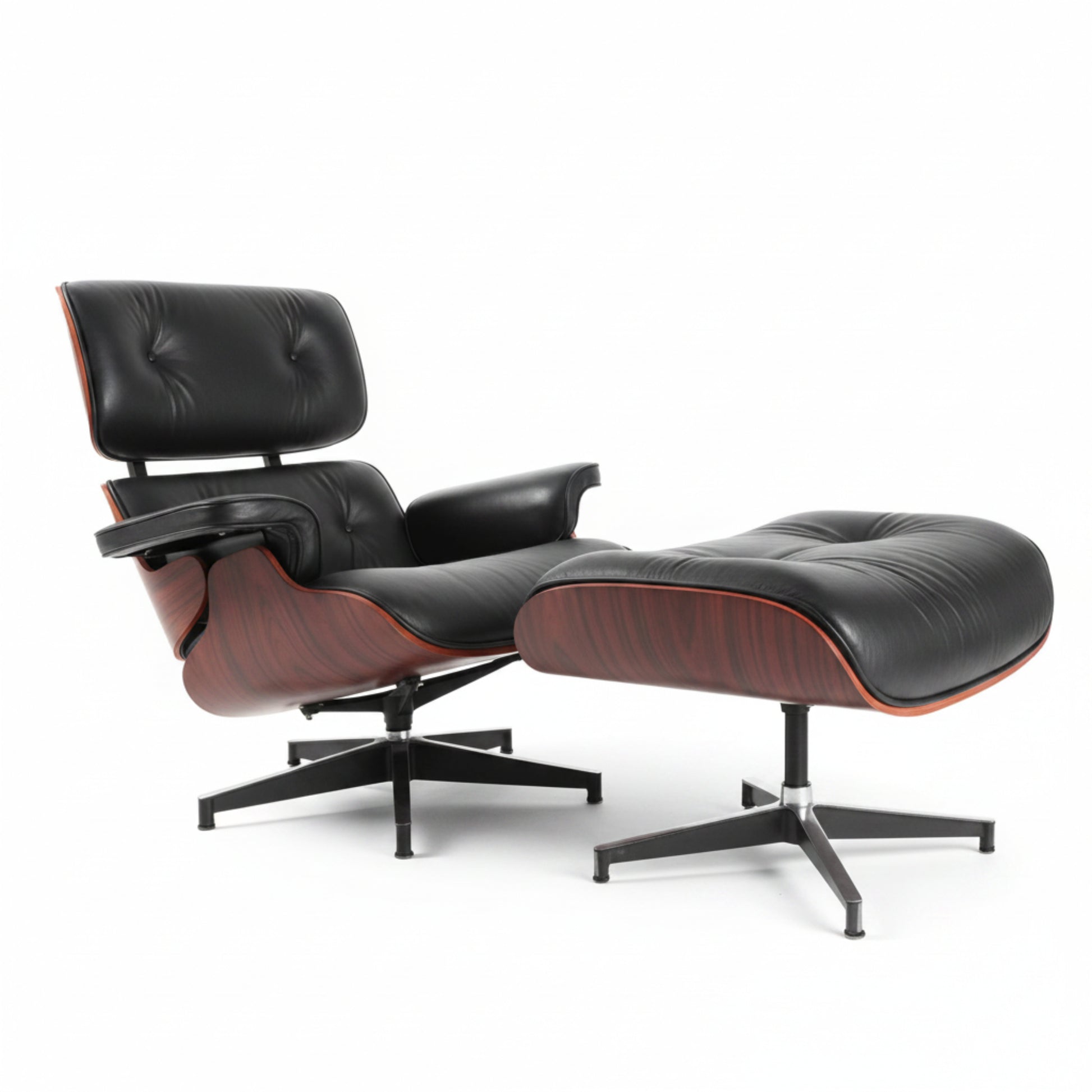 A classic mid-century modern lounge chair with matching ottoman, featuring black leather upholstery, reddish-brown wood veneer